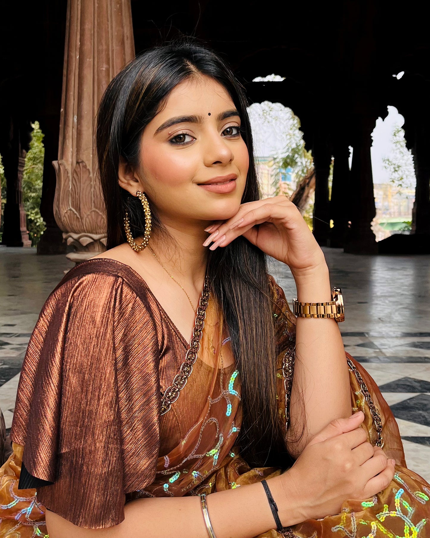 Model pairing the blouse with a saree for a festive event