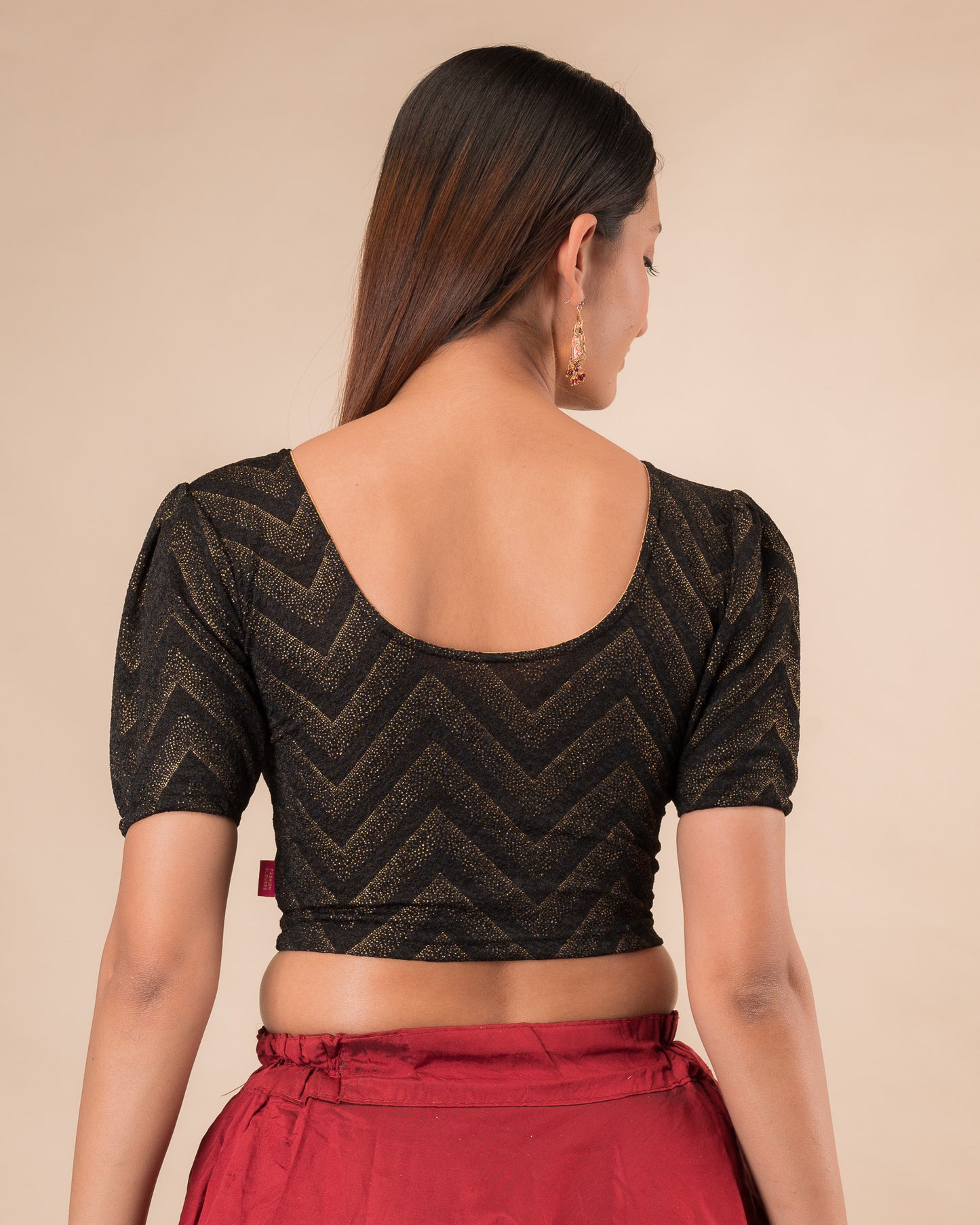 Rear view showcasing the slip-on design and ruffled shoulder detail