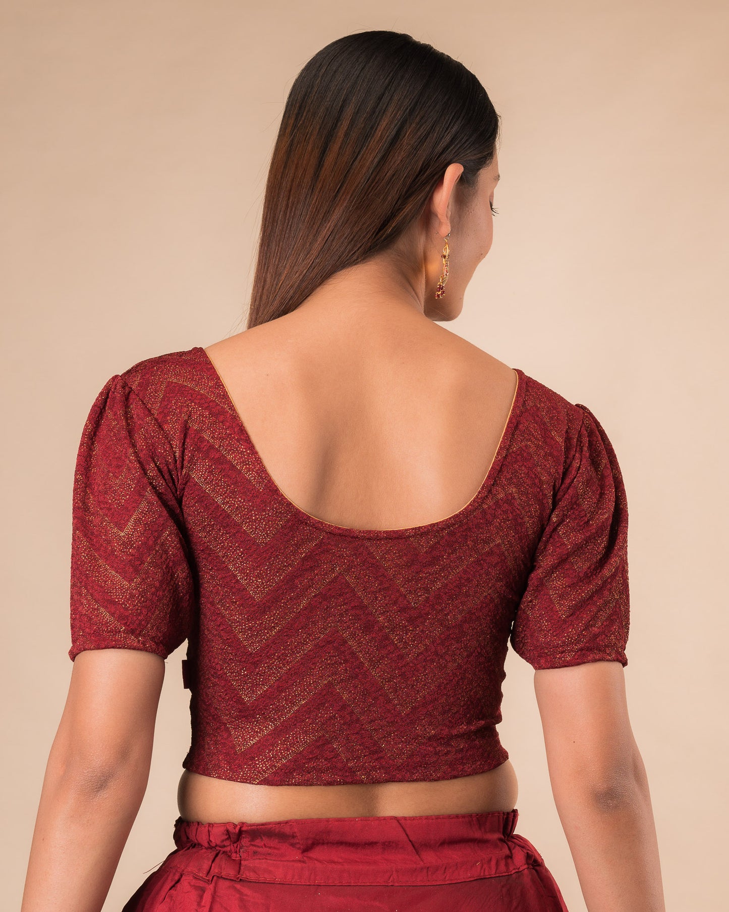 Rear view showcasing the slip-on design and ruffled shoulder detail