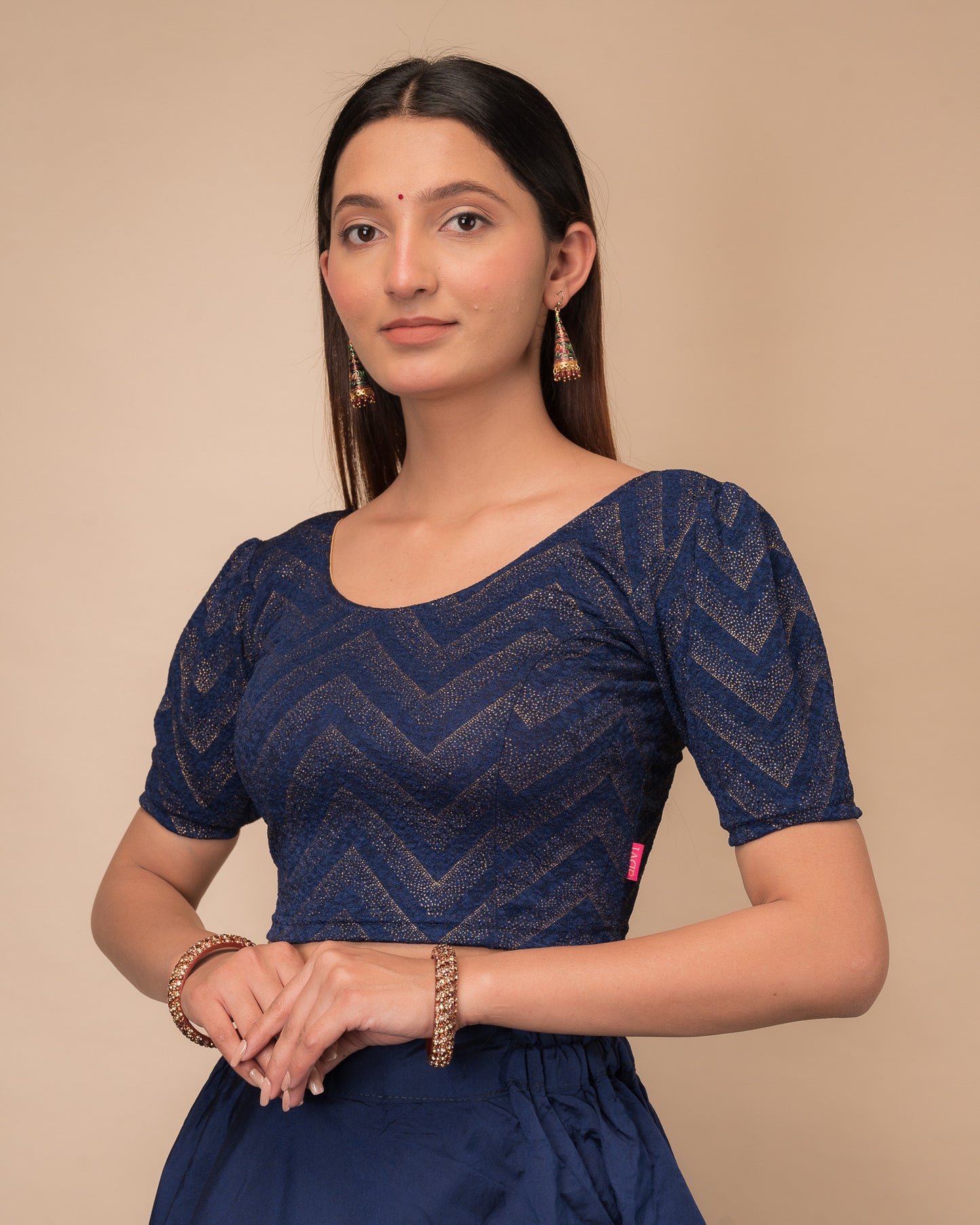 Side view highlighting the fit and shoulder ruffles