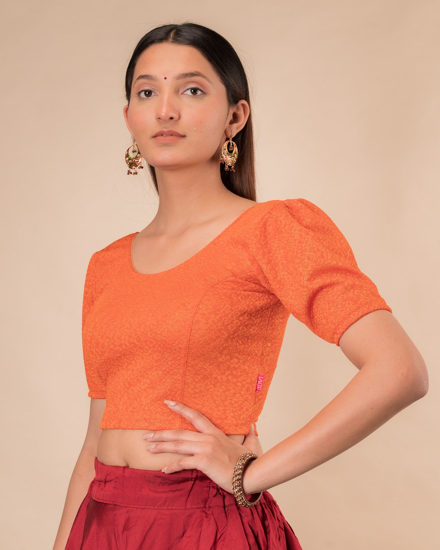 Side view highlighting the fit and shoulder ruffles