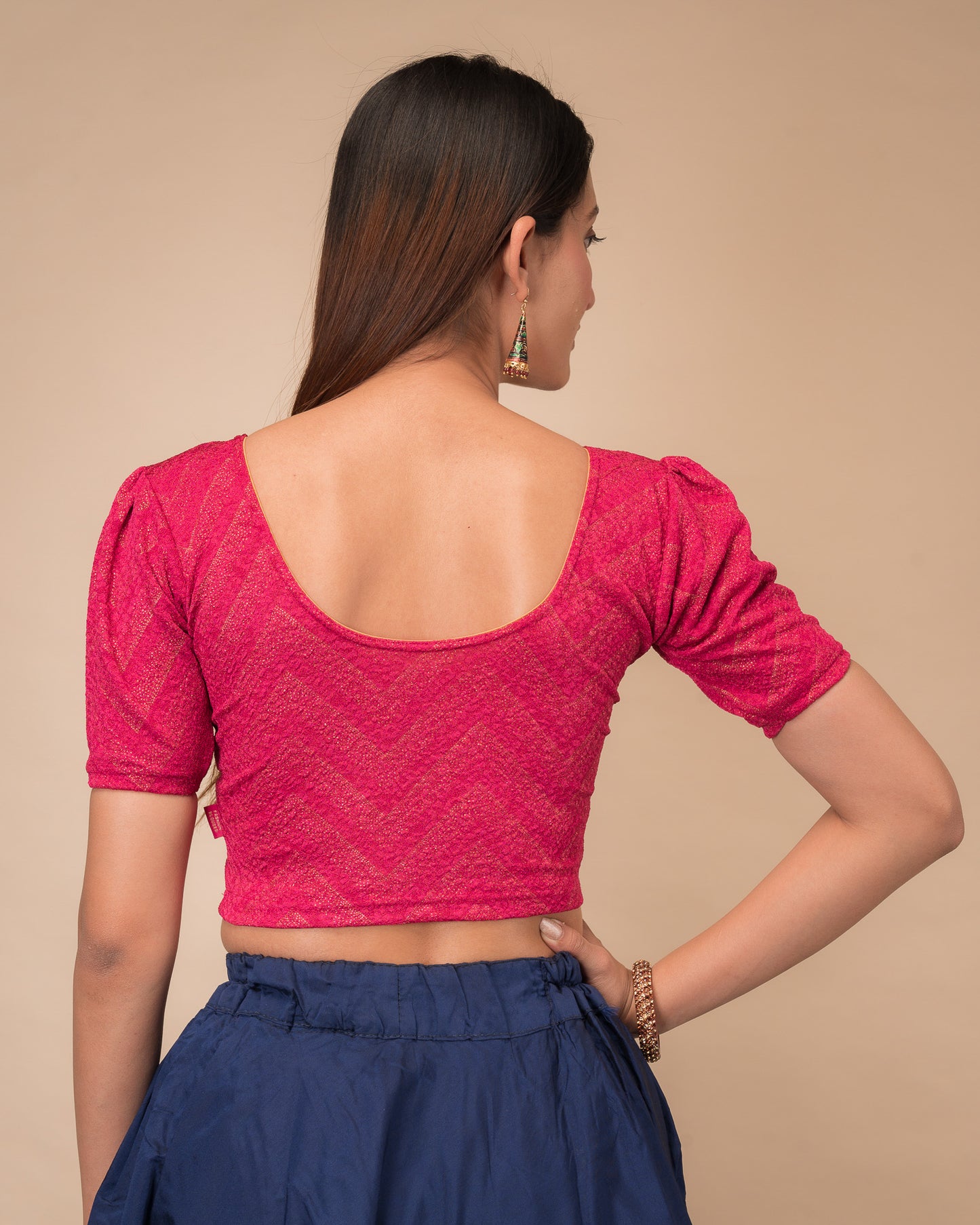Rear view showcasing the slip-on design and ruffled shoulder detail