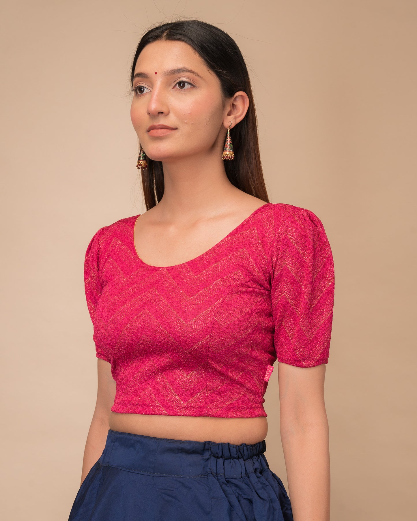 Side view highlighting the fit and shoulder ruffles