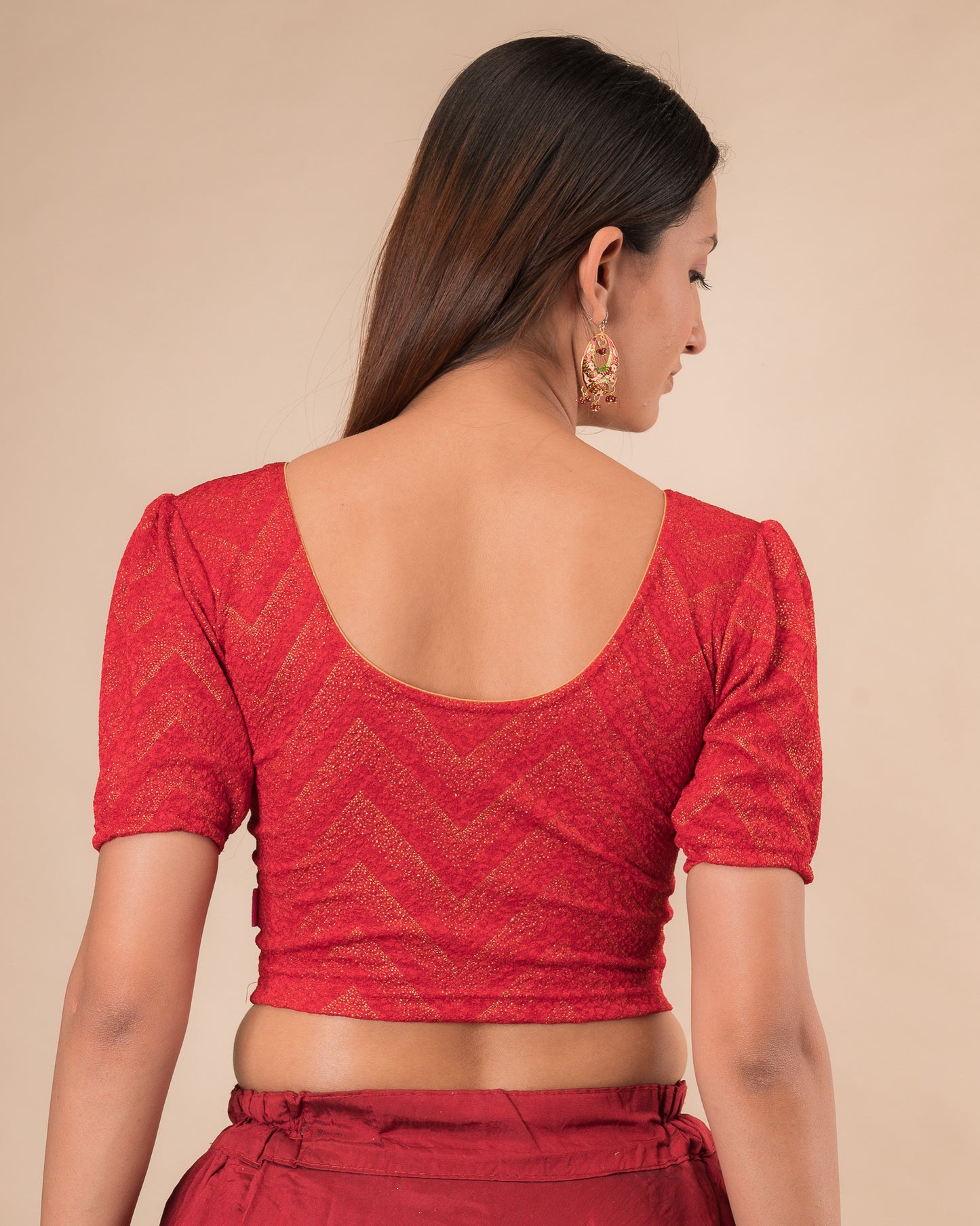 Rear view showcasing the slip-on design and ruffled shoulder detail