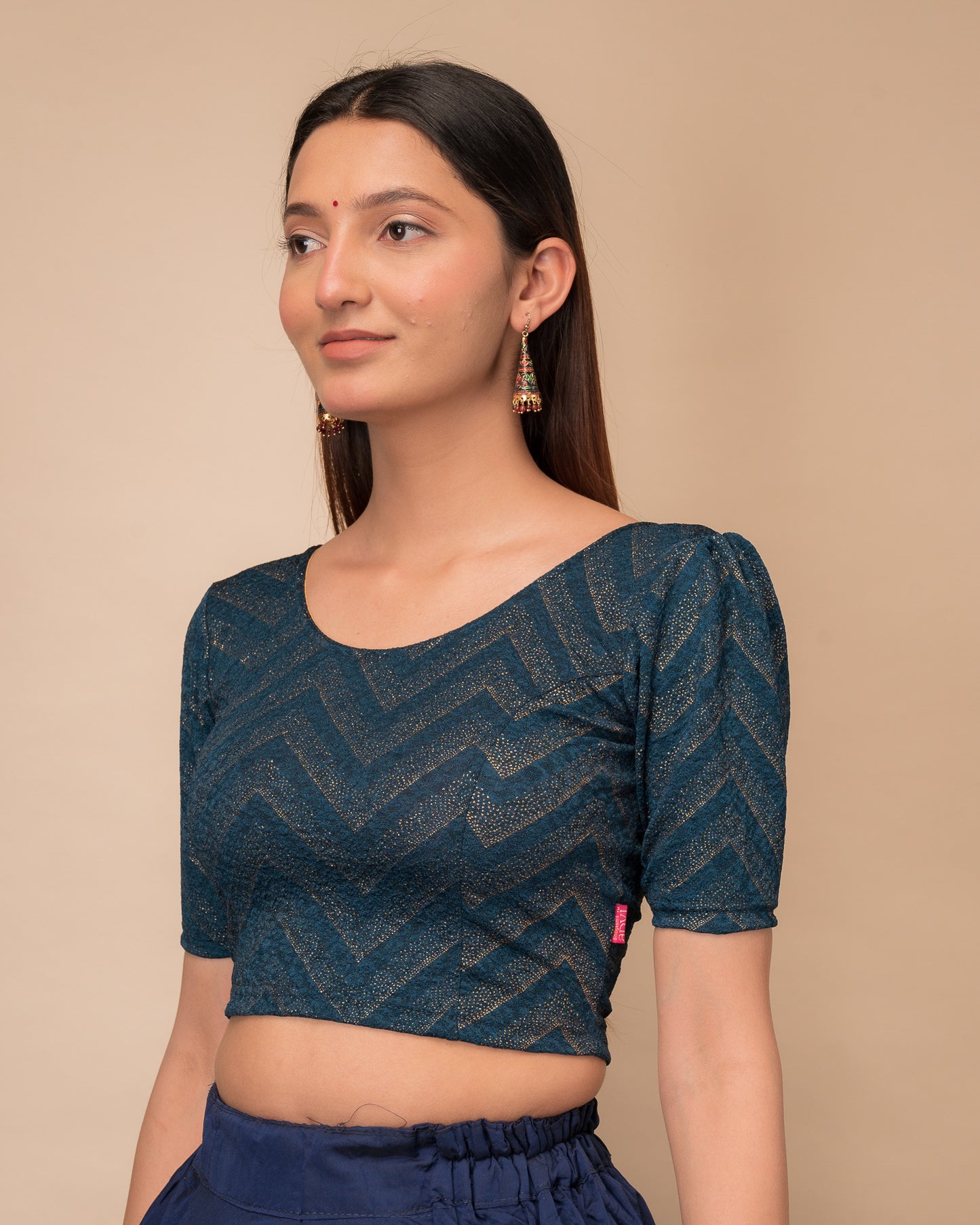 Side view highlighting the fit and shoulder ruffles