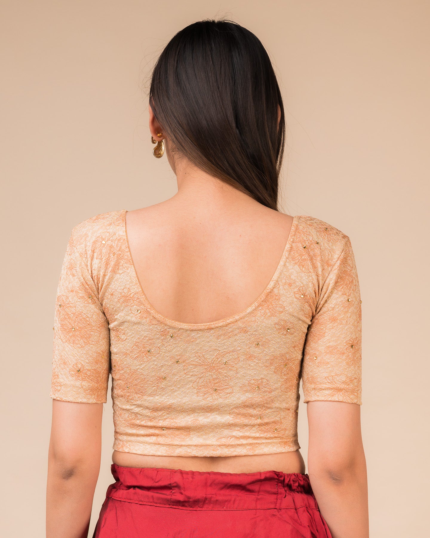 Rear view showcasing the back design texture and embellishments