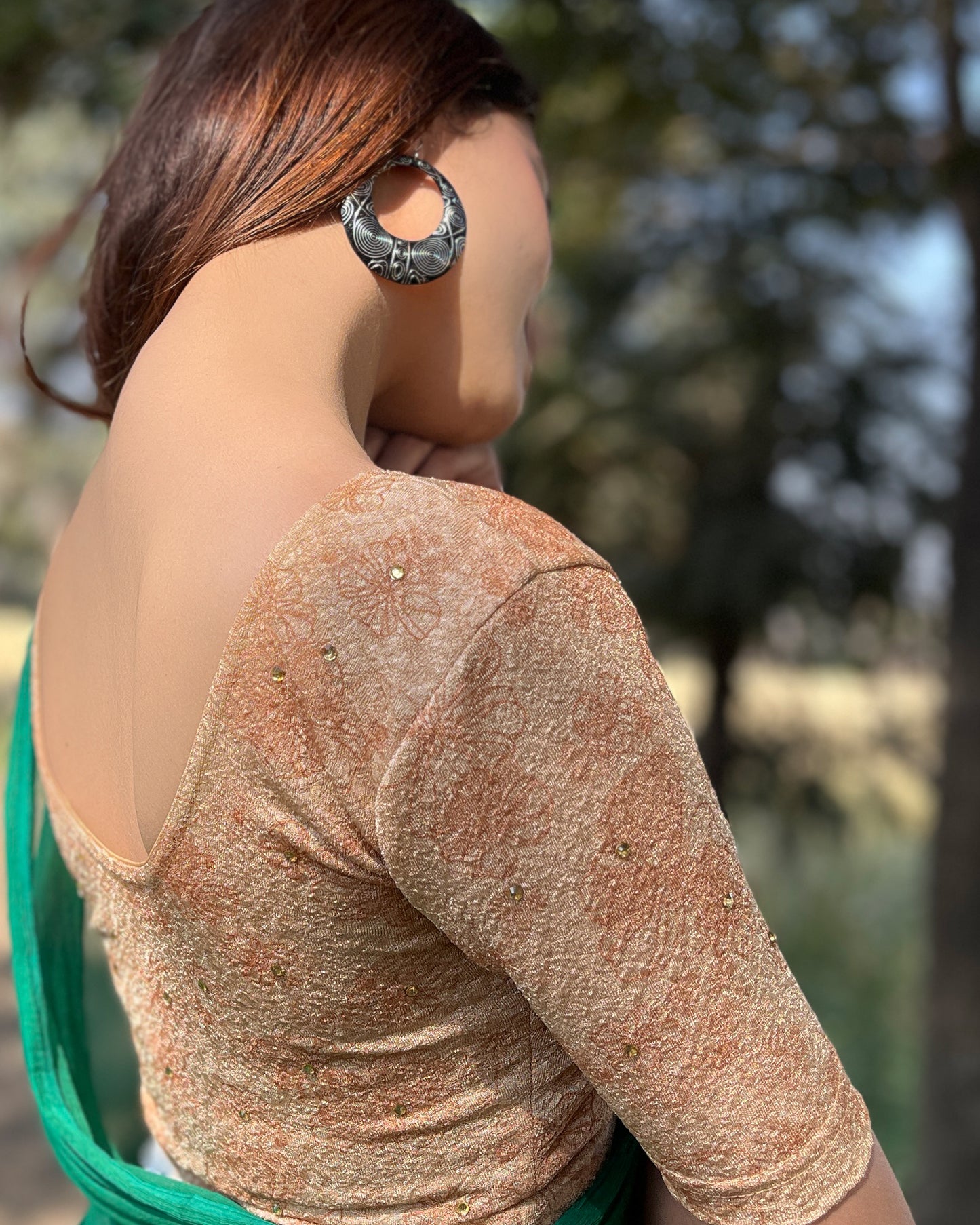 Model pairing the blouse with a festive saree for occasions