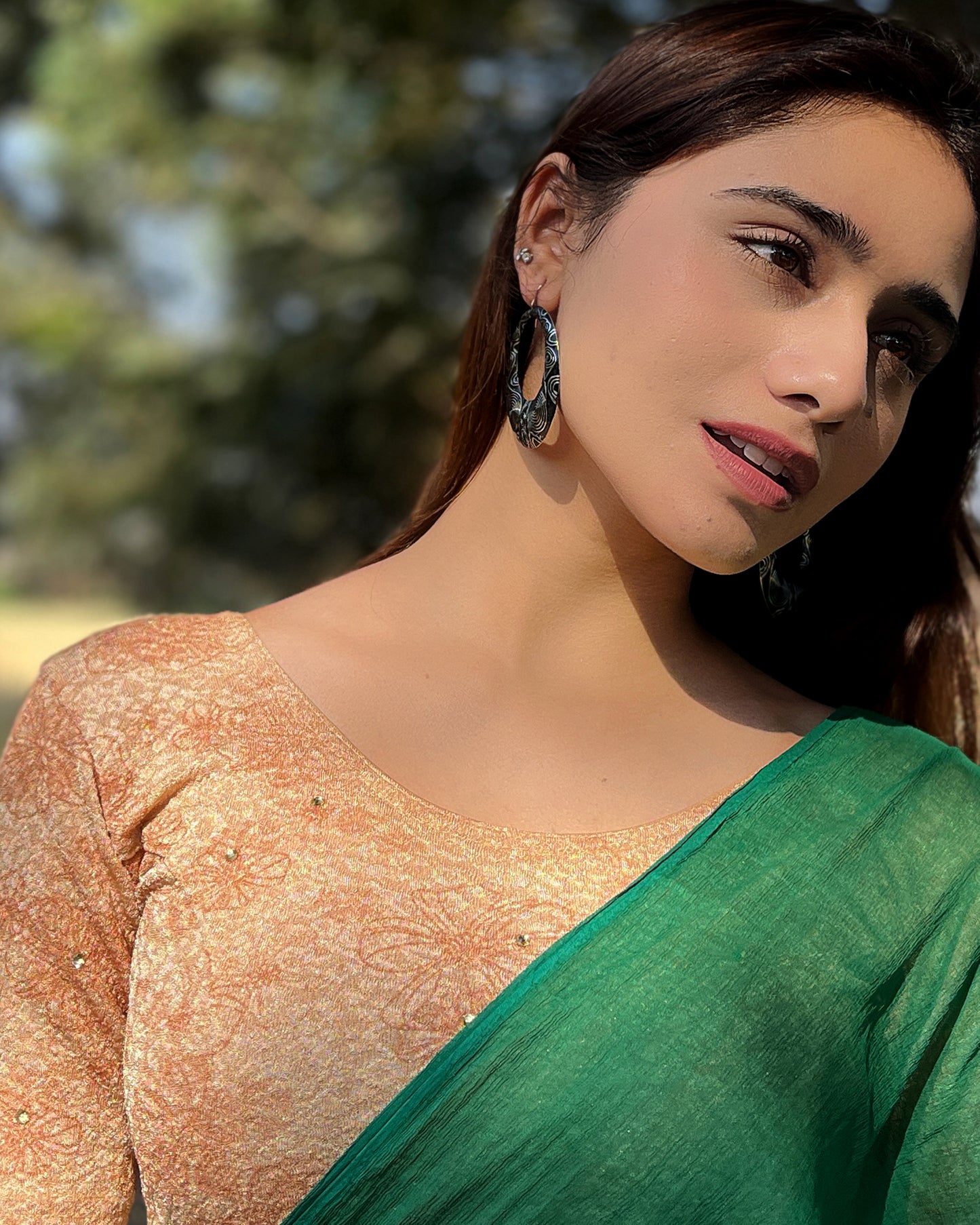 Model pairing the blouse with a festive saree for occasions