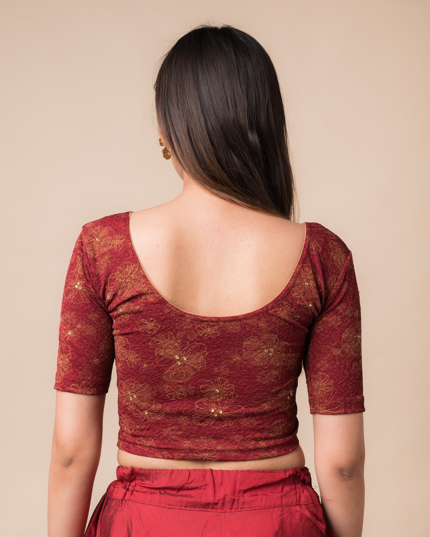 Rear view showcasing the back design texture and embellishments