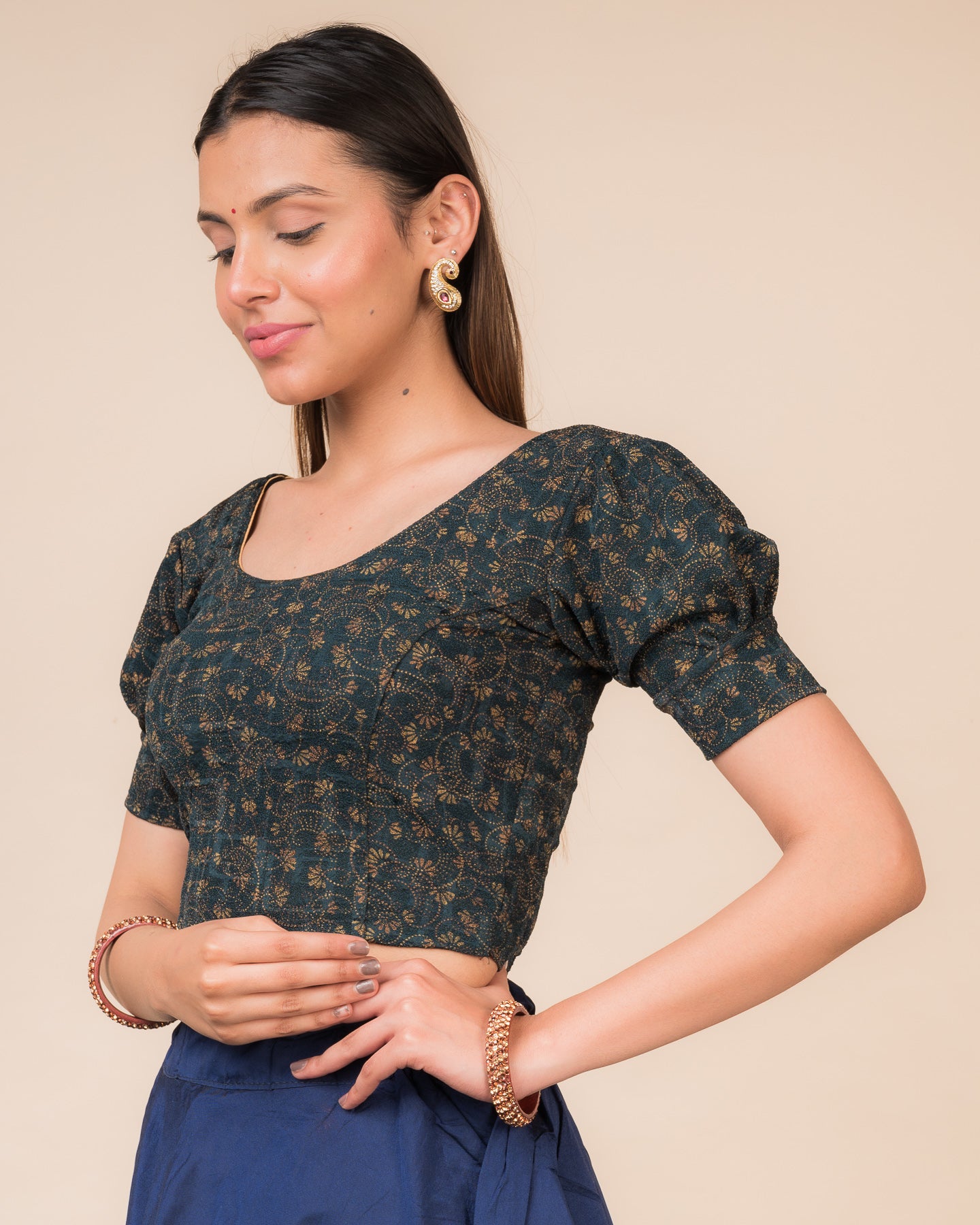 Side profile highlighting the fit, sleeve length, and back buckle feature