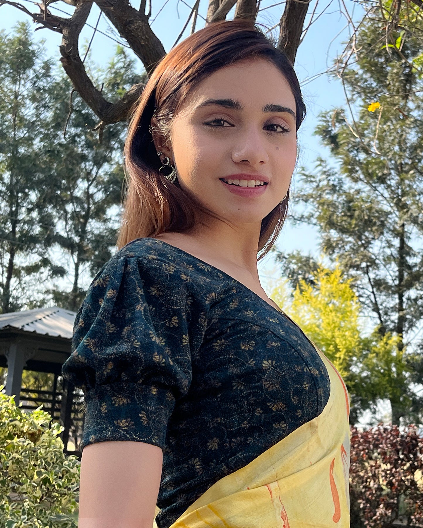 Model pairing the blouse with a saree for a refined festive look