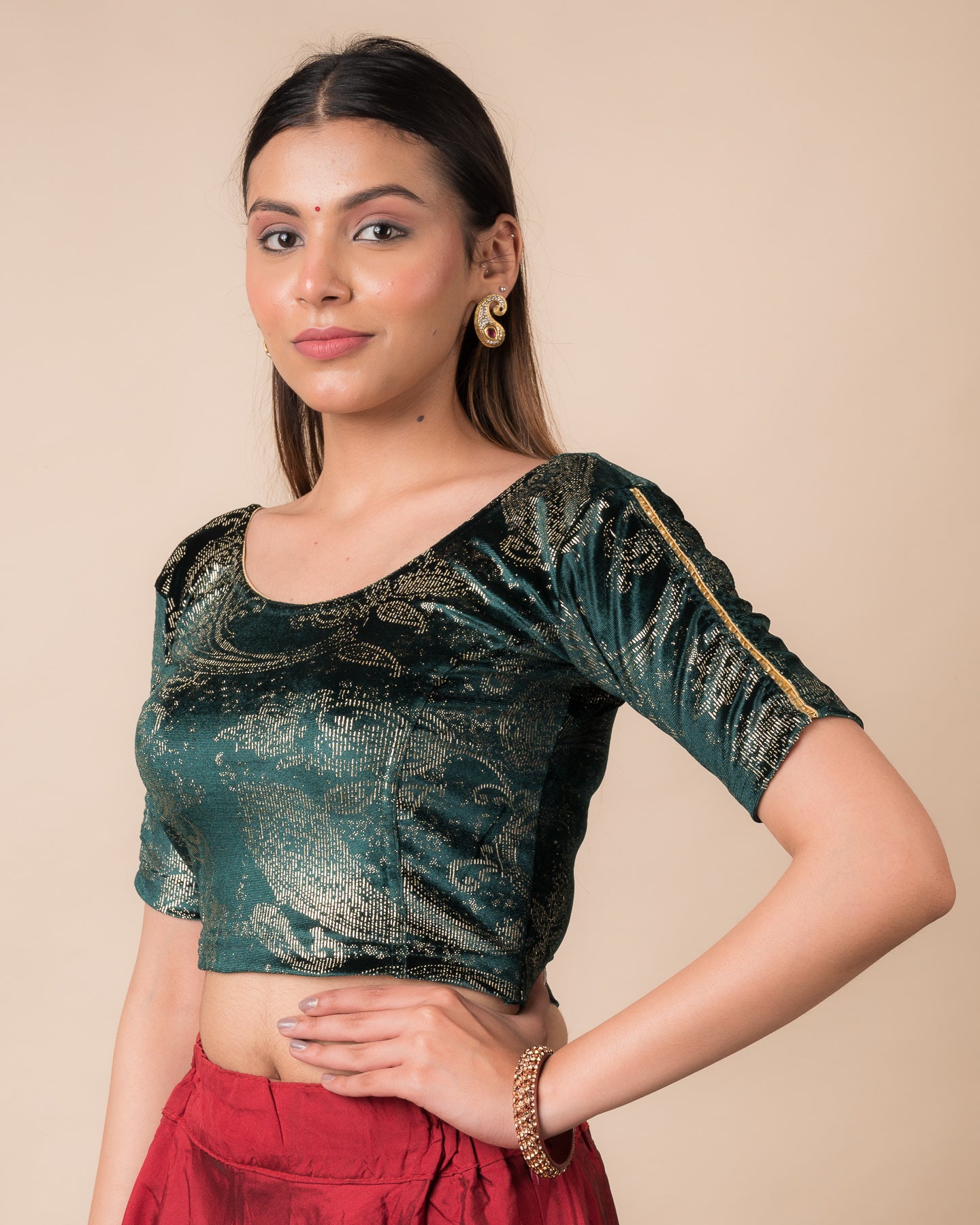 Side profile highlighting the fit, sleeve length, and velvet drape