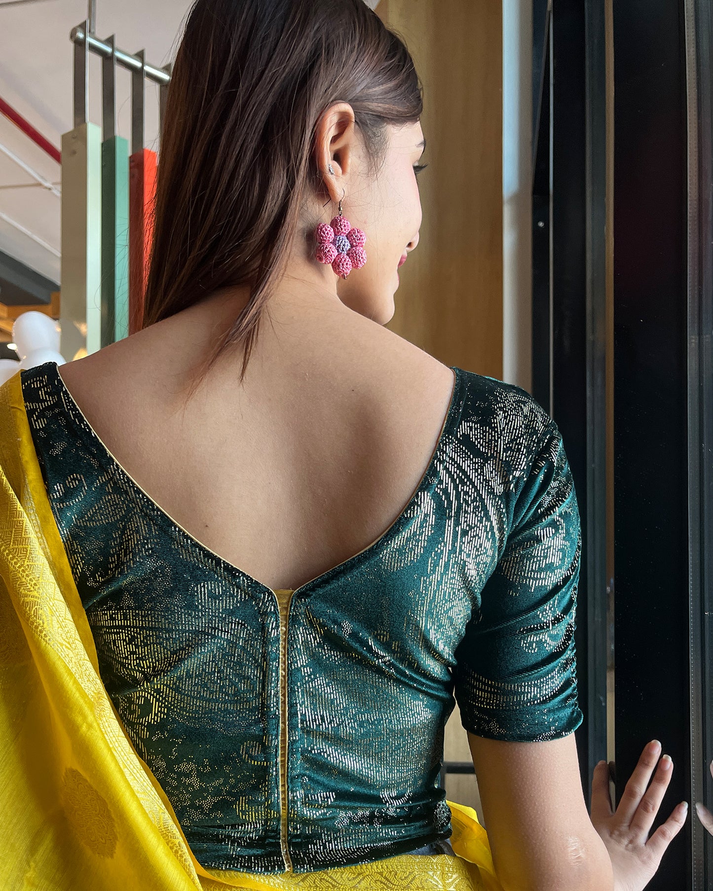 Model pairing the blouse with a festive saree for an elegant ethnic look