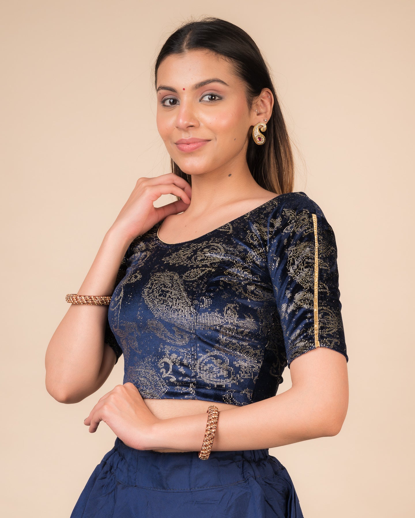 Side profile highlighting the fit, sleeve length, and velvet drape