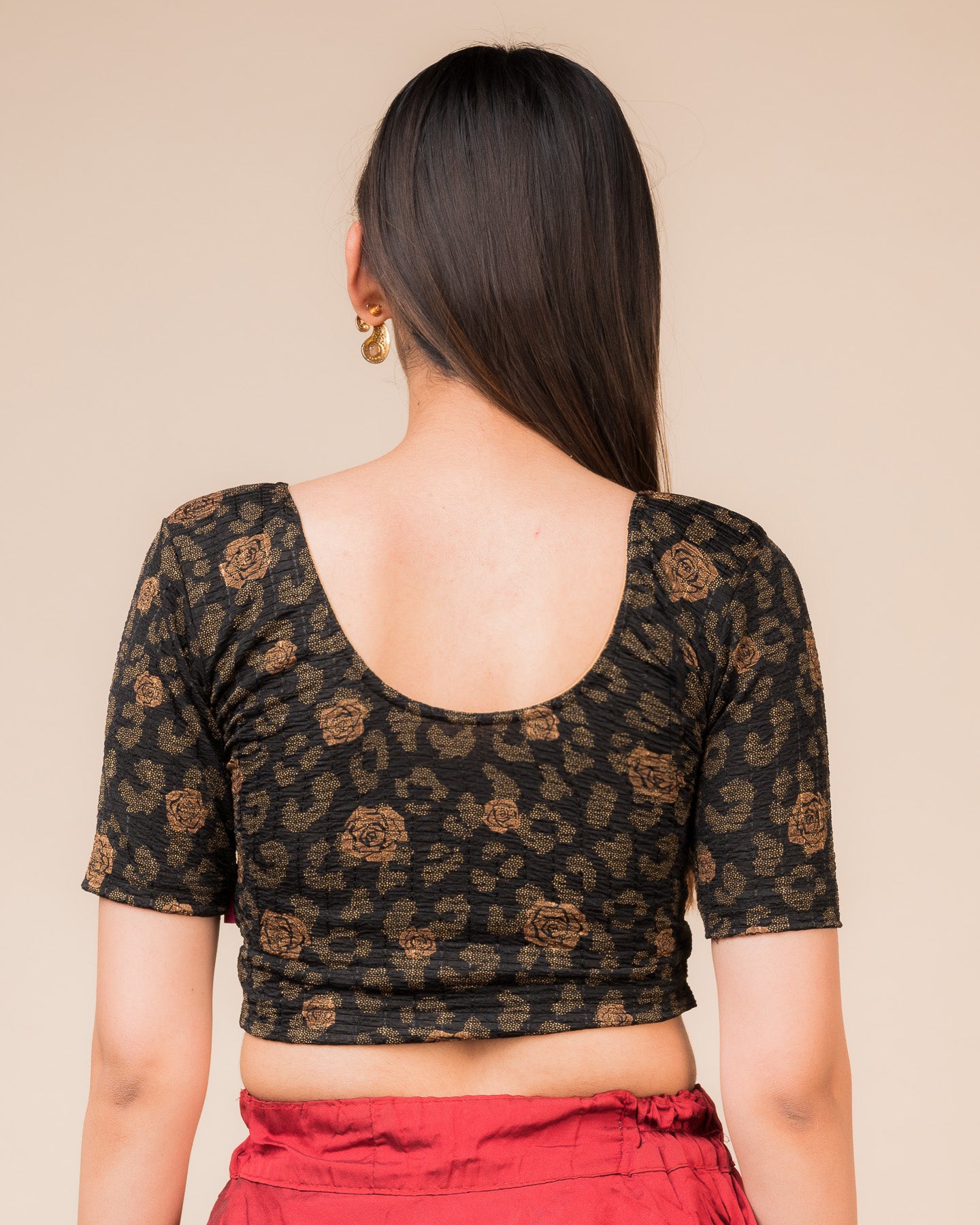 Rear view showcasing the blouse’s slip-on design and back texture