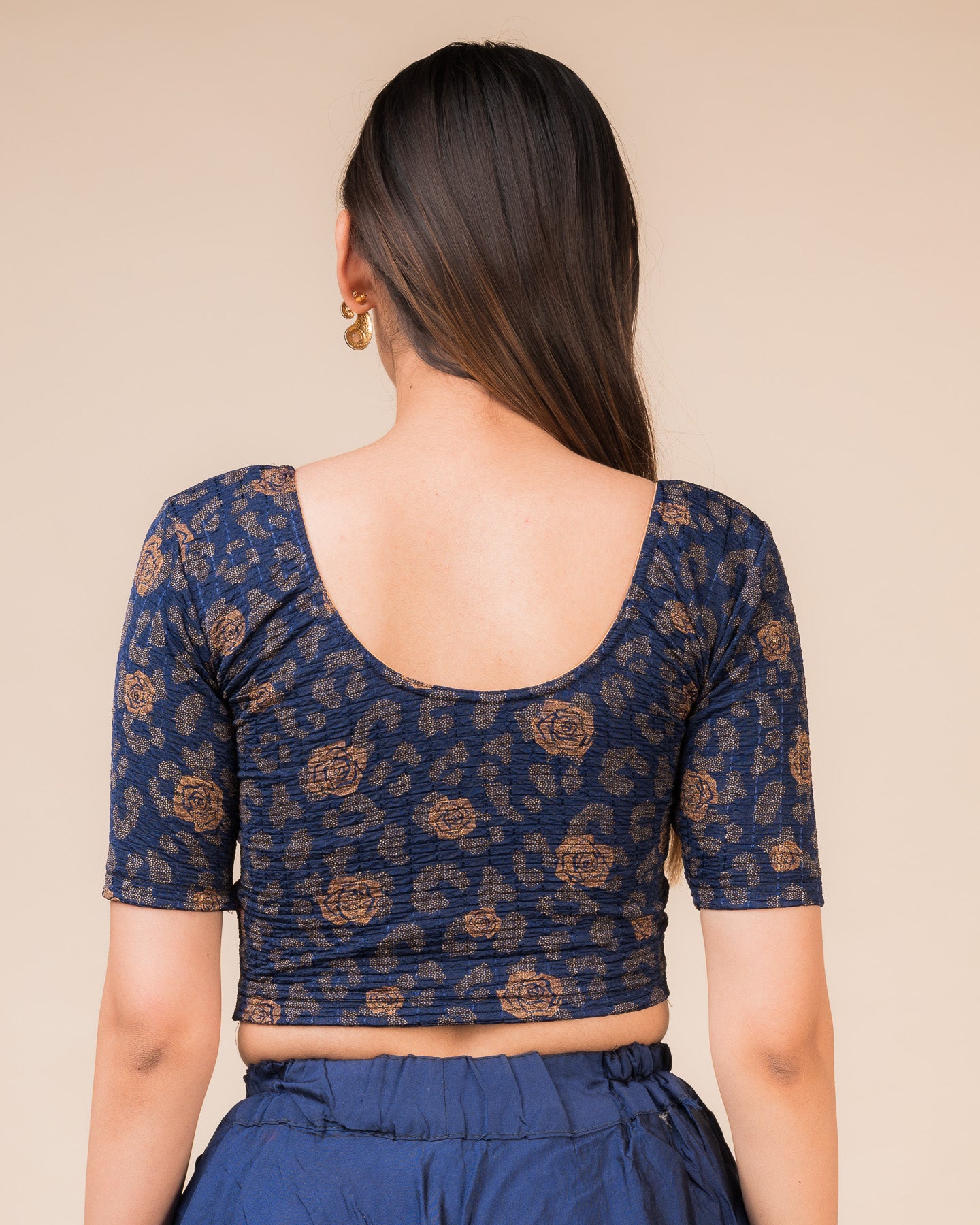 Rear view showcasing the blouse’s slip-on design and back texture
