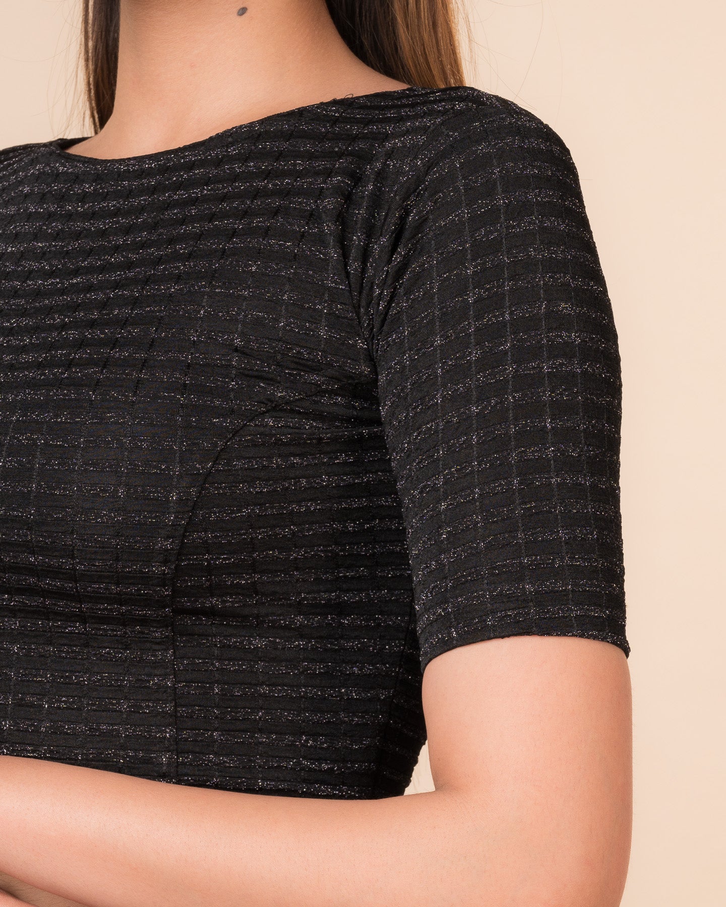 Close-up of the jacquard fabric detailing the gold and silver stripes