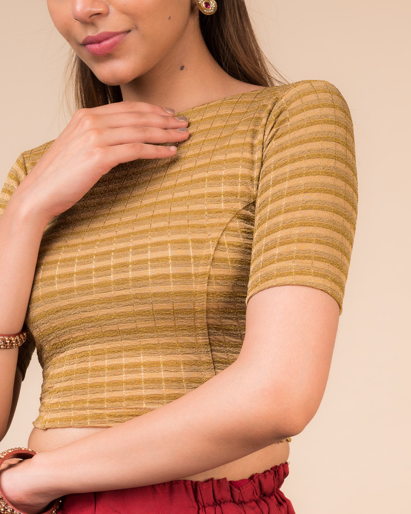 Close-up of the jacquard fabric detailing the gold and silver stripes