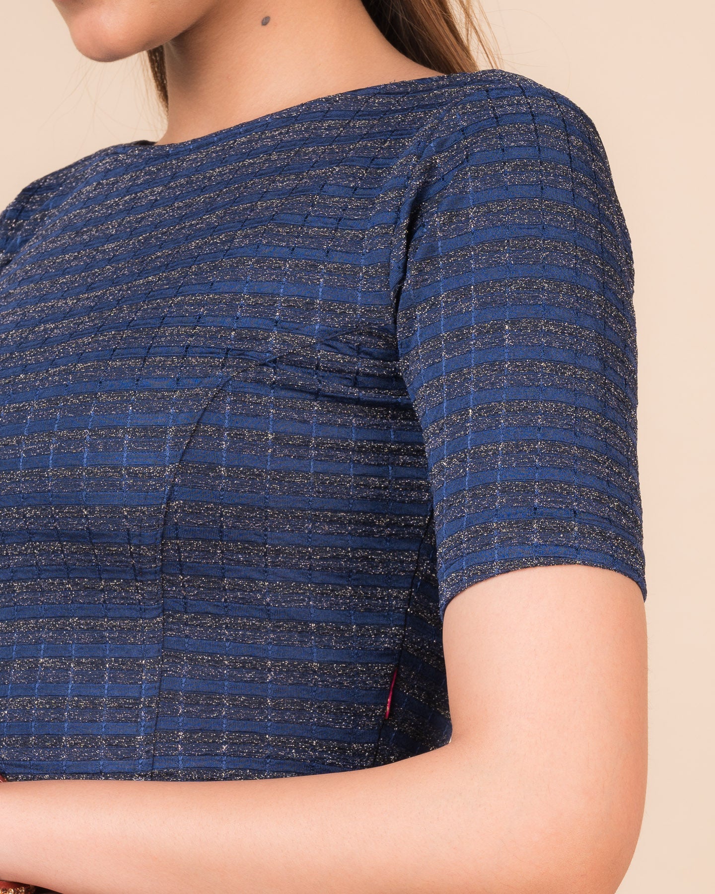 Close-up of the jacquard fabric detailing the gold and silver stripes