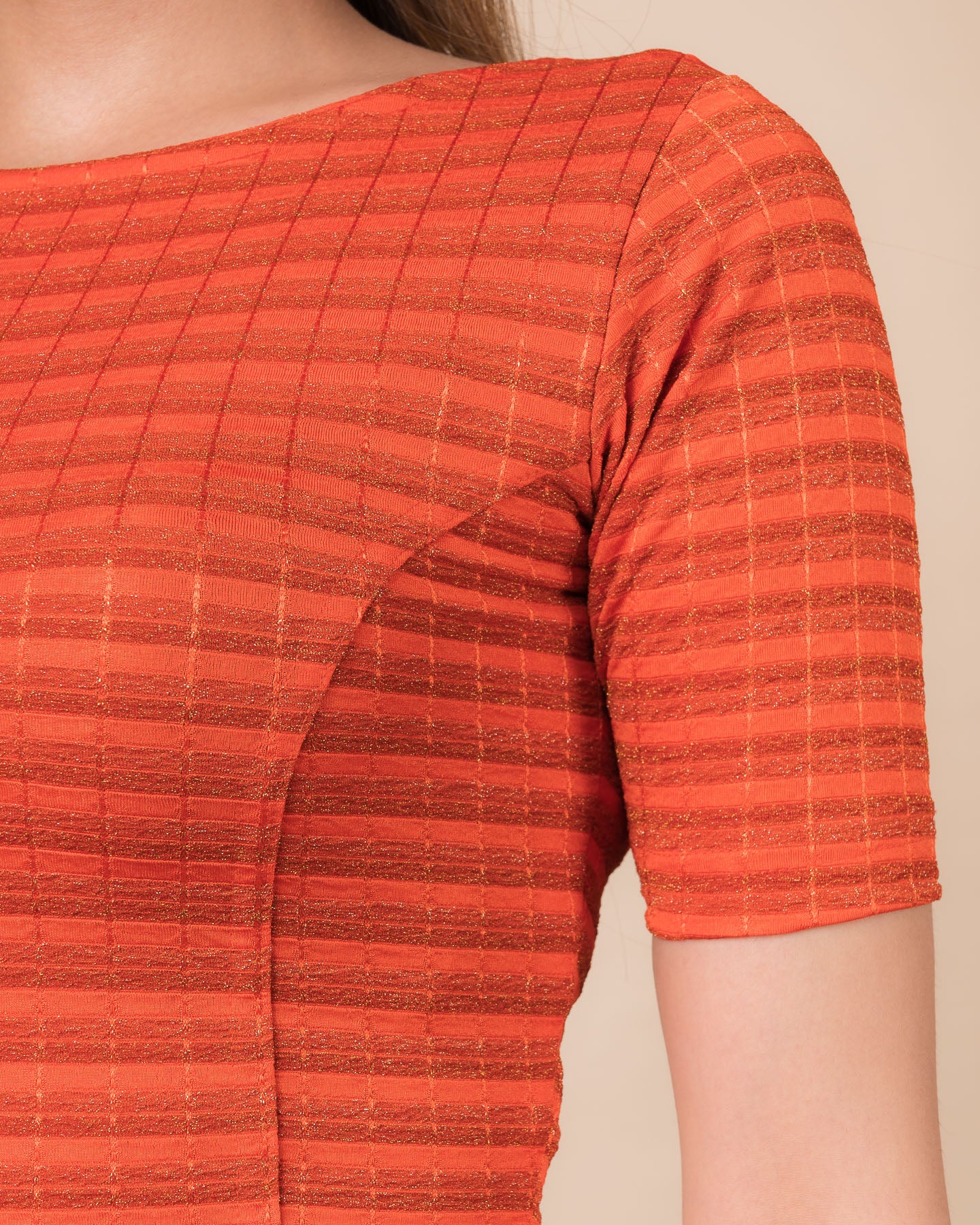 Close-up of the jacquard fabric detailing the gold and silver stripes