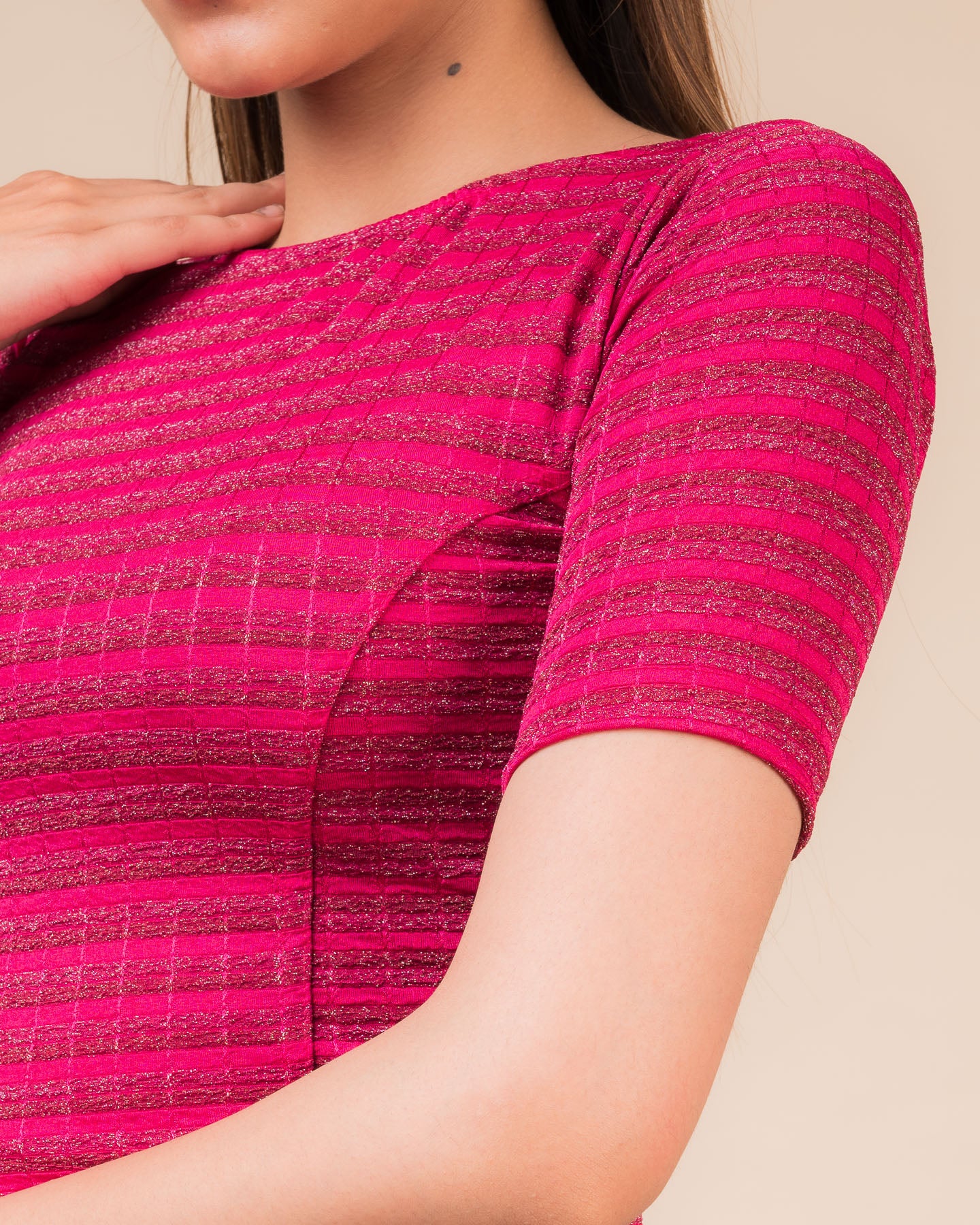 Close-up of the jacquard fabric detailing the gold and silver stripes
