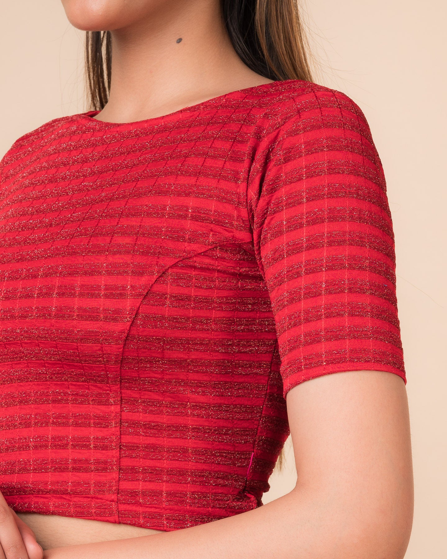 Close-up of the jacquard fabric detailing the gold and silver stripes