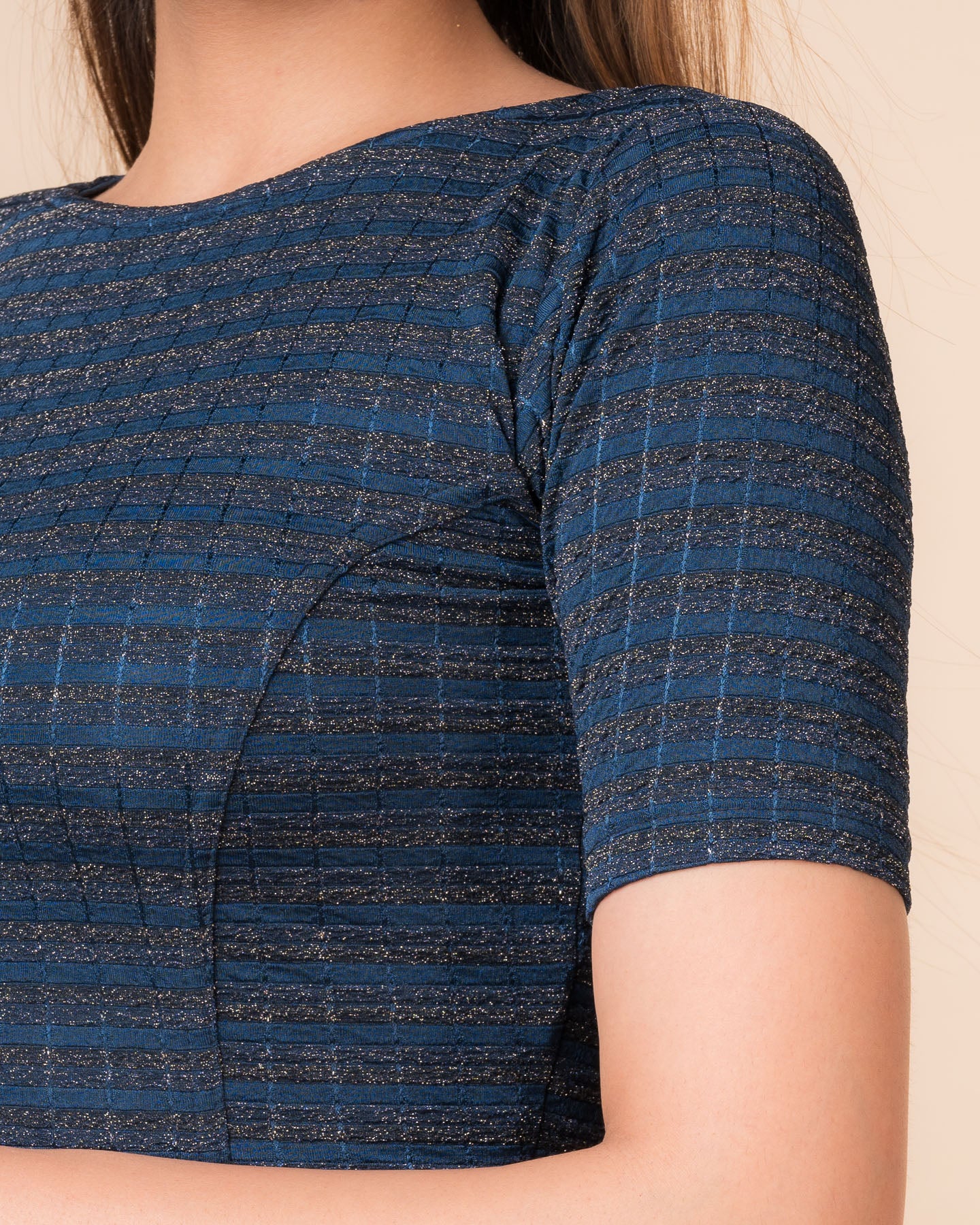 Close-up of the jacquard fabric detailing the gold and silver stripes