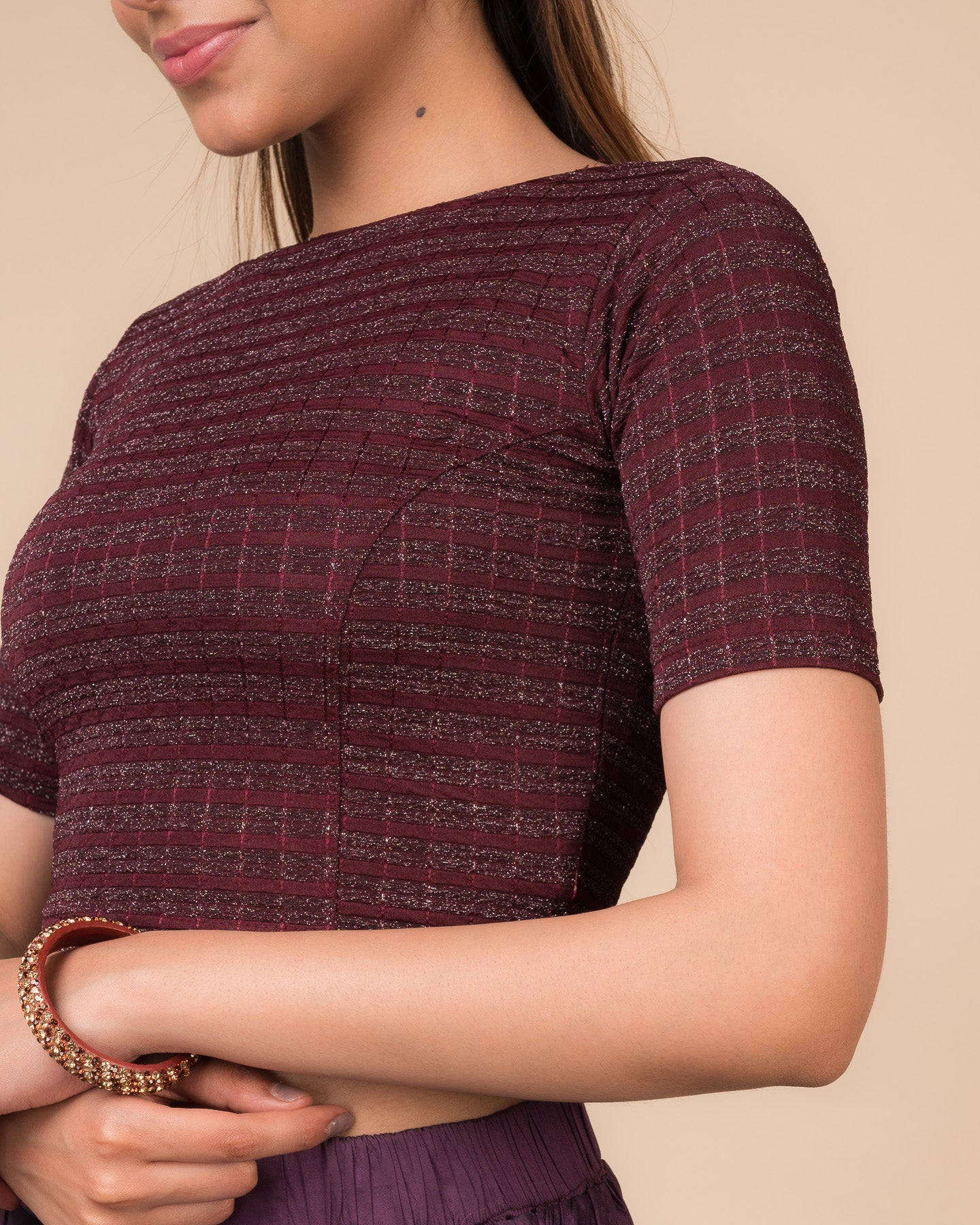 Close-up of the jacquard fabric detailing the gold and silver stripes