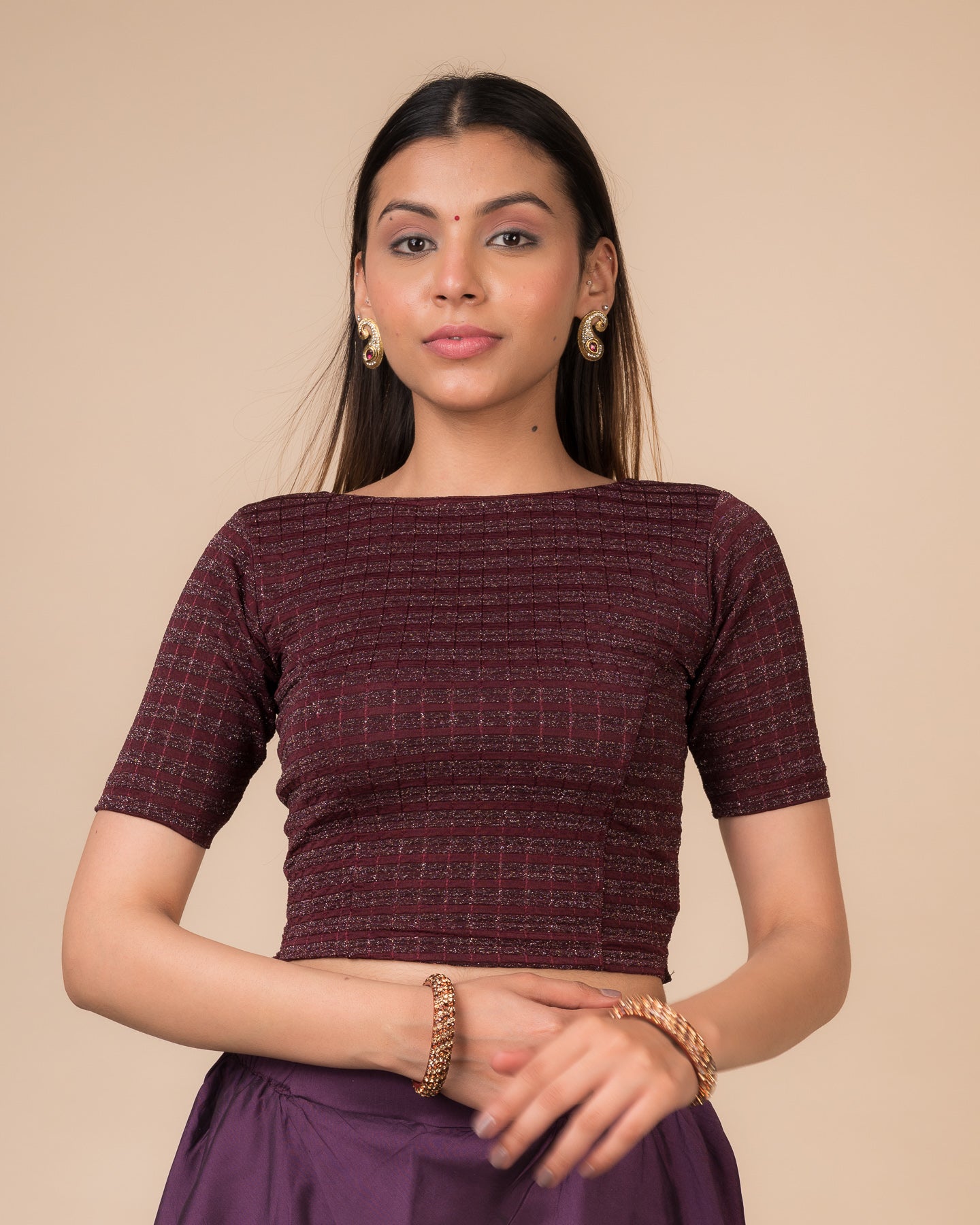 Model wearing a Wine metallic-striped stretchable blouse with elbow sleeves and boat neckline