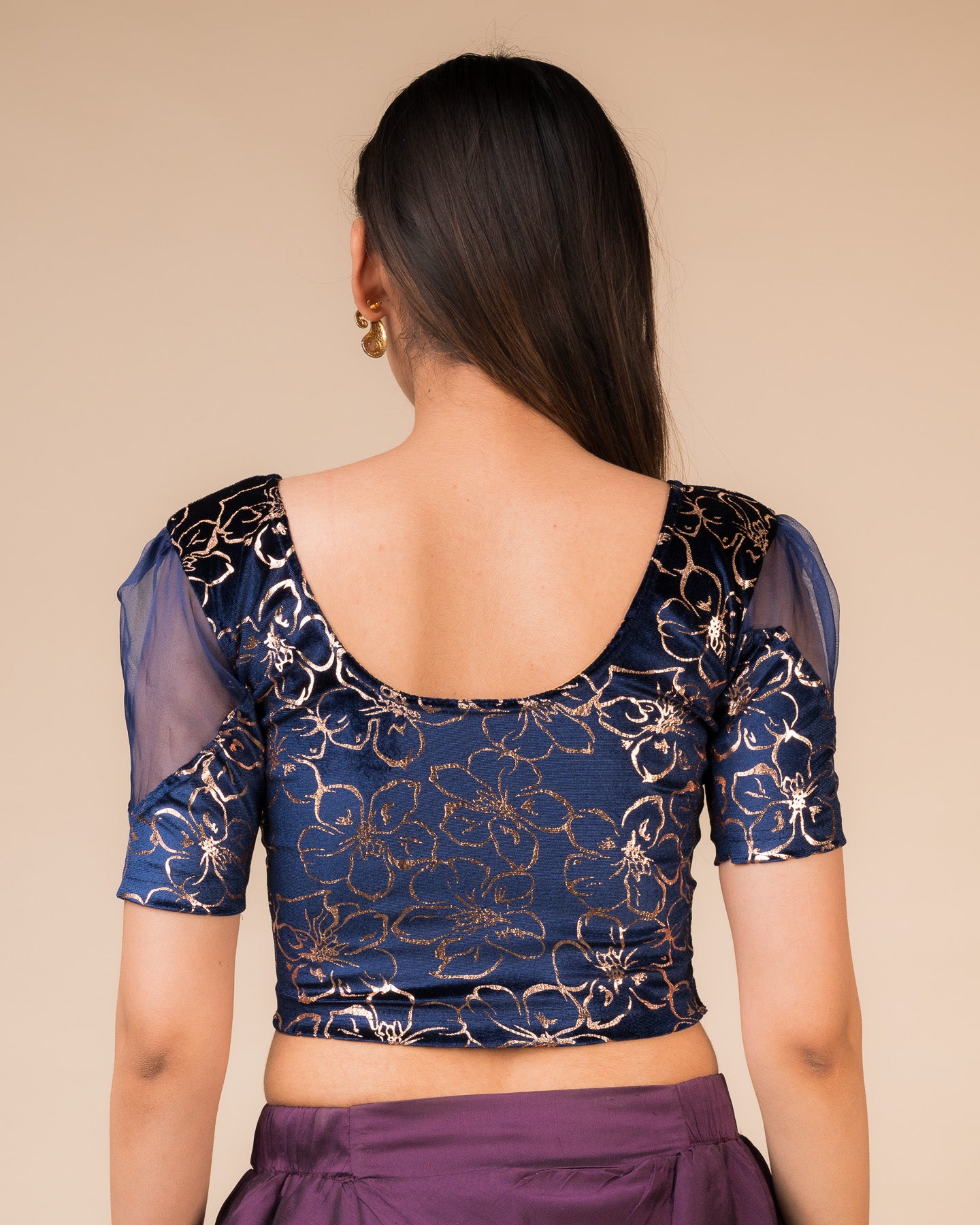 Rear view showcasing the back design and velvet drape