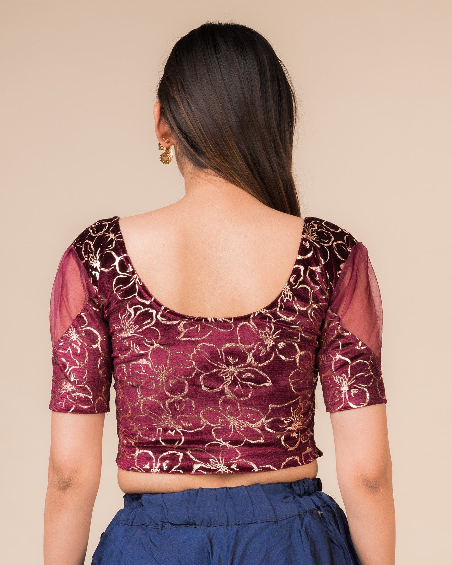 Rear view showcasing the back design and velvet drape