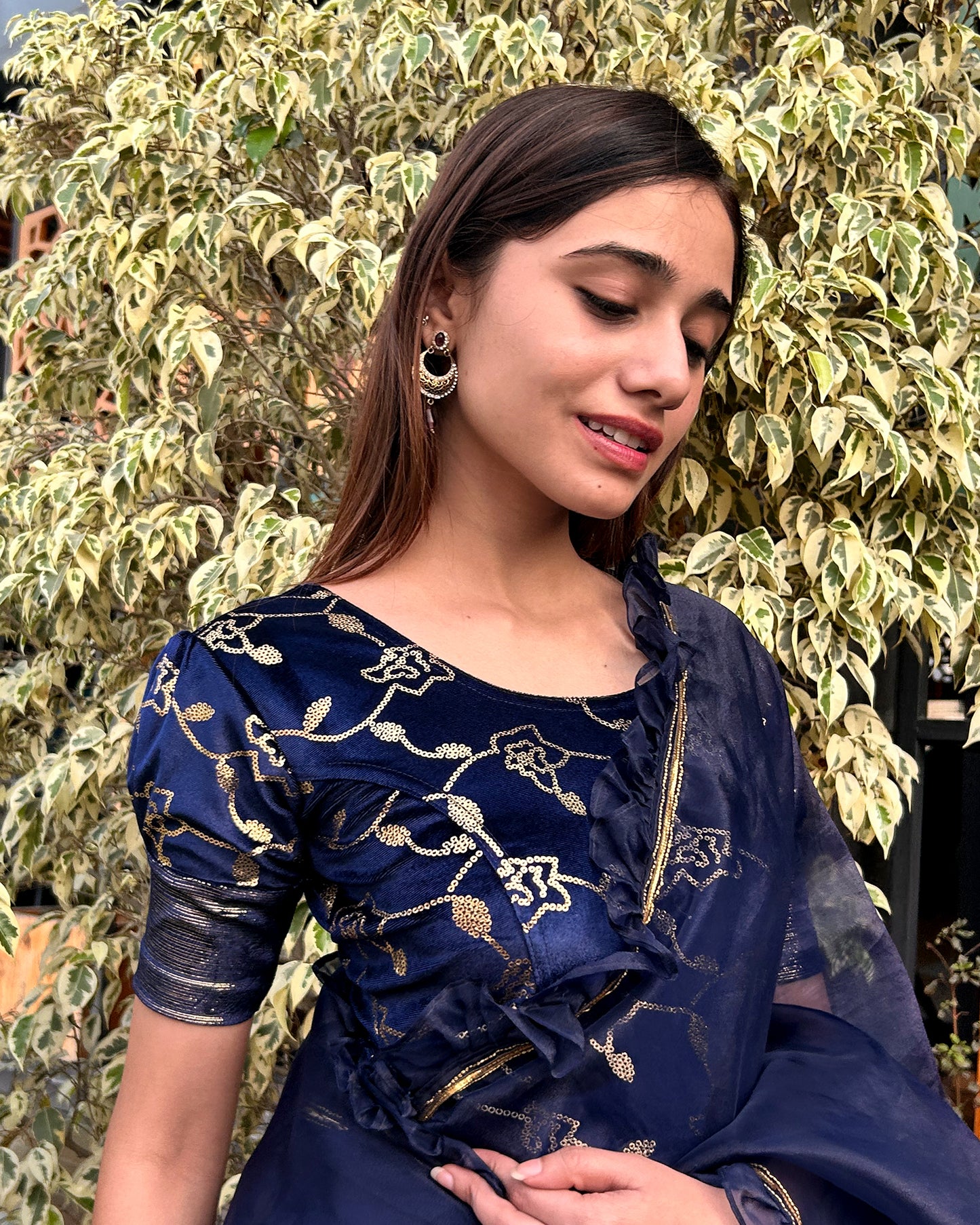 Model pairing the blouse with a festive saree for party occasions