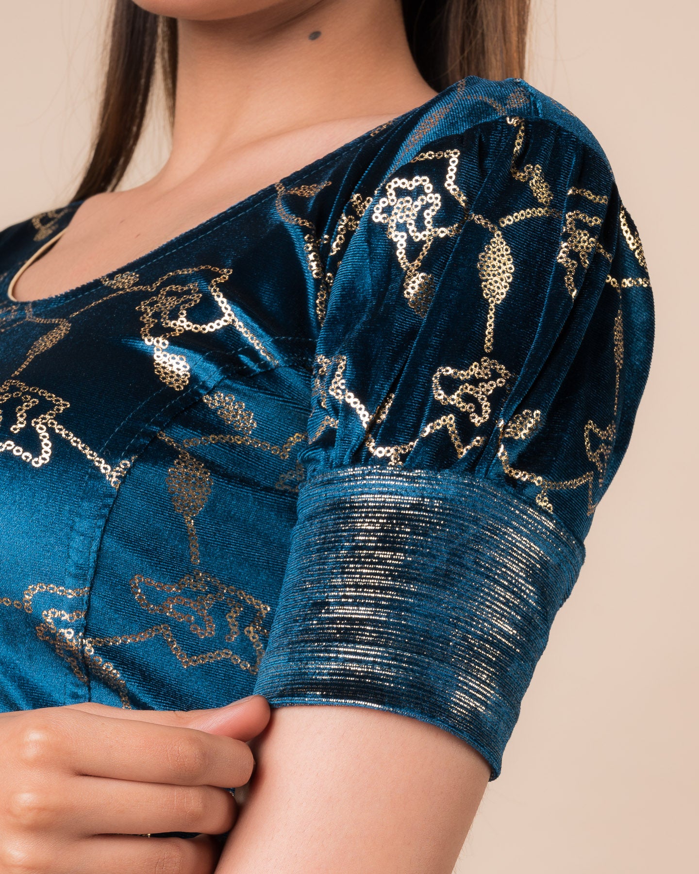 Close-up of the velvet with sequin foil detailing