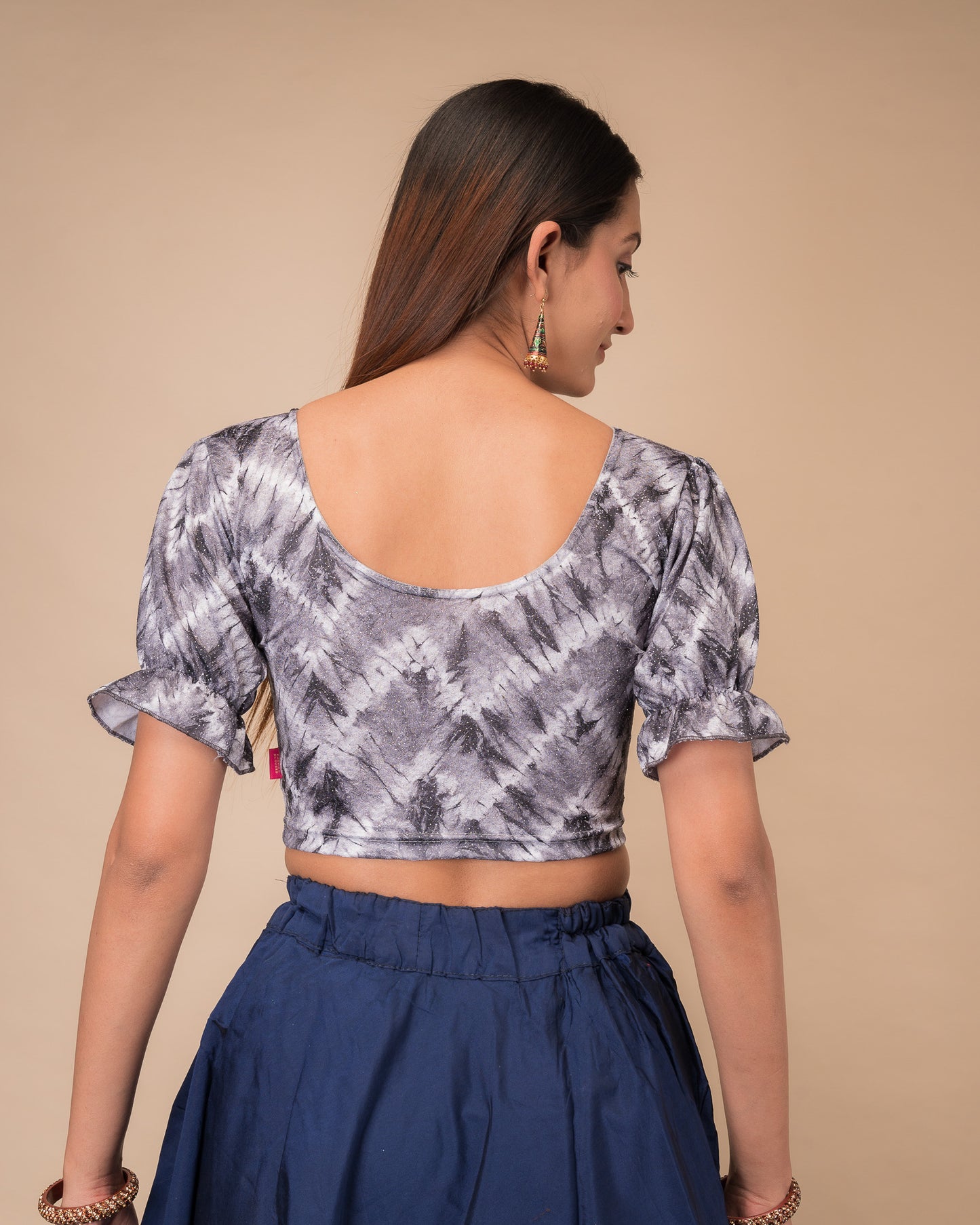 Rear view showcasing the slip-on back design and tie-dye pattern