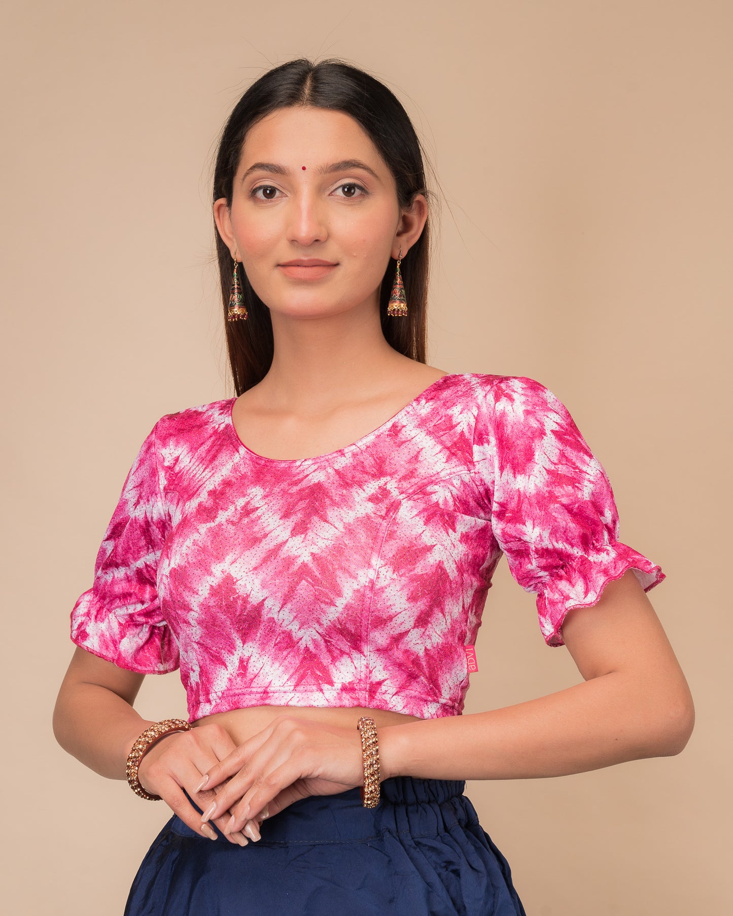 Side profile highlighting the fit, pleated sleeve detail, and tie-dye texture
