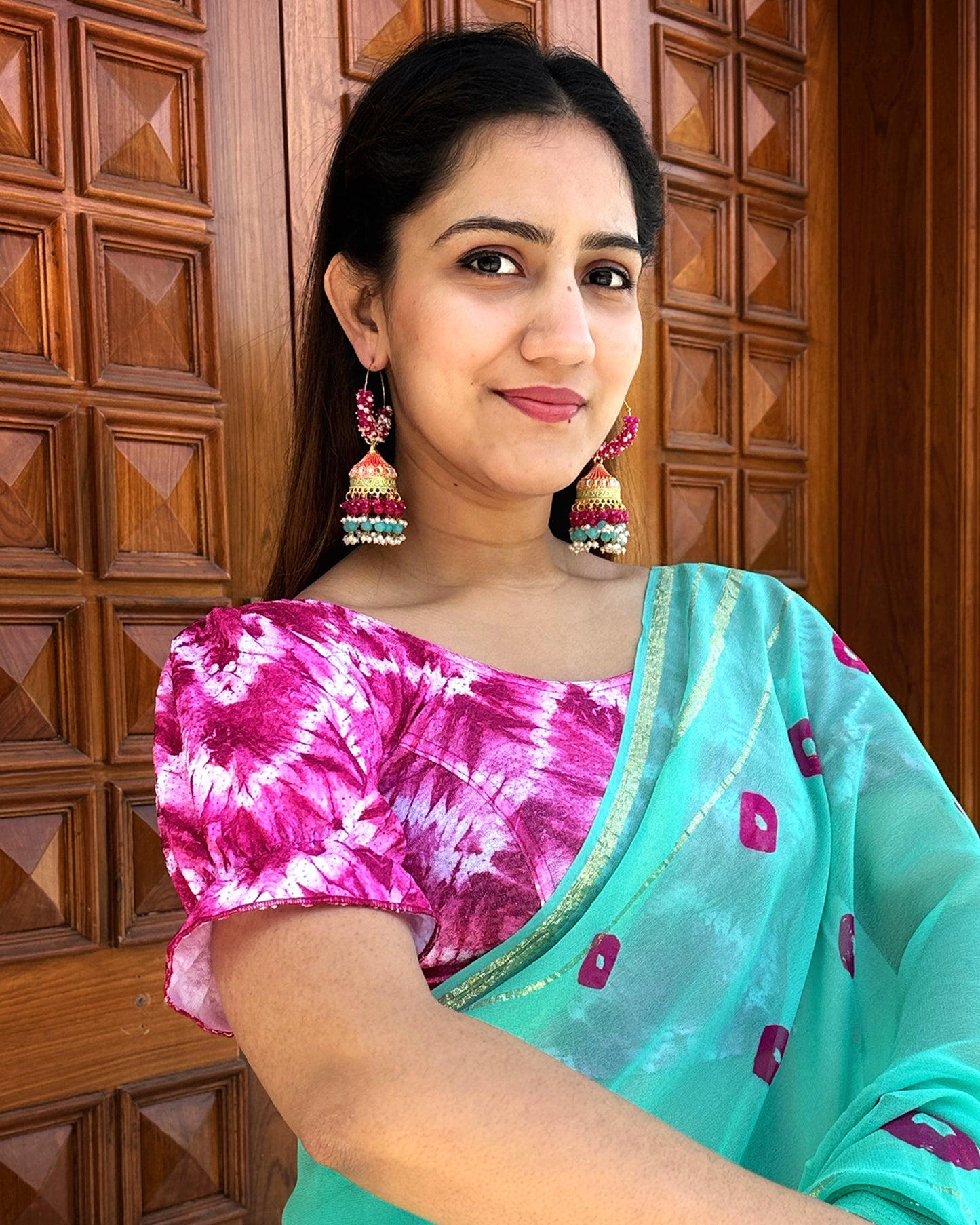 Model pairing the blouse with a festive saree to complete the ethnic look