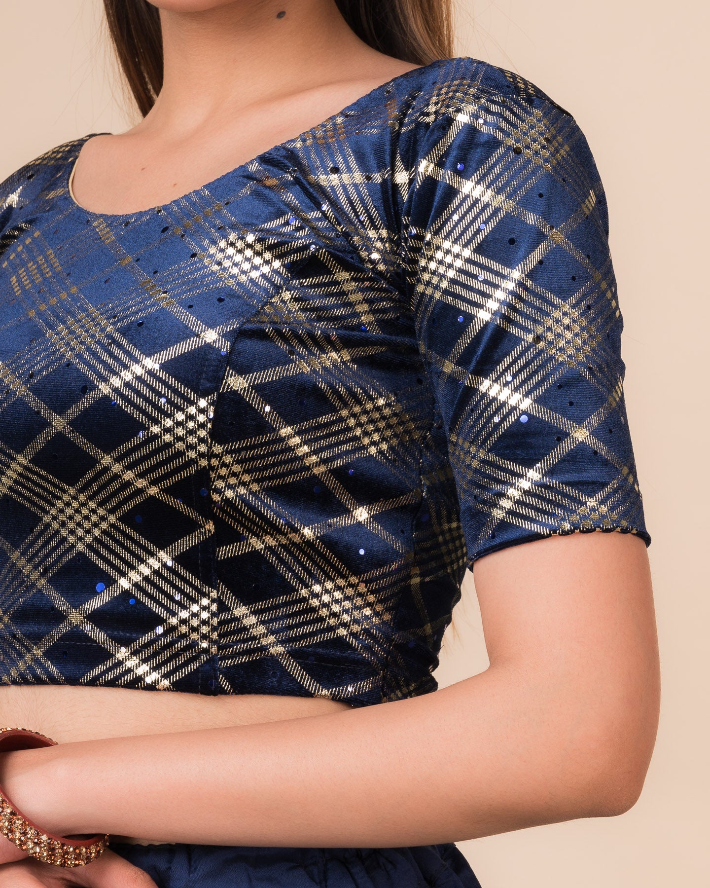 Close‑up of the jacquard fabric showing check pattern and sequins