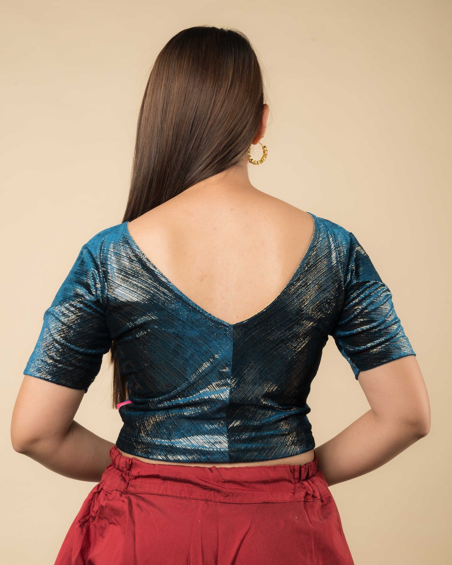 Rear view showcasing the back silhouette and velvet drape