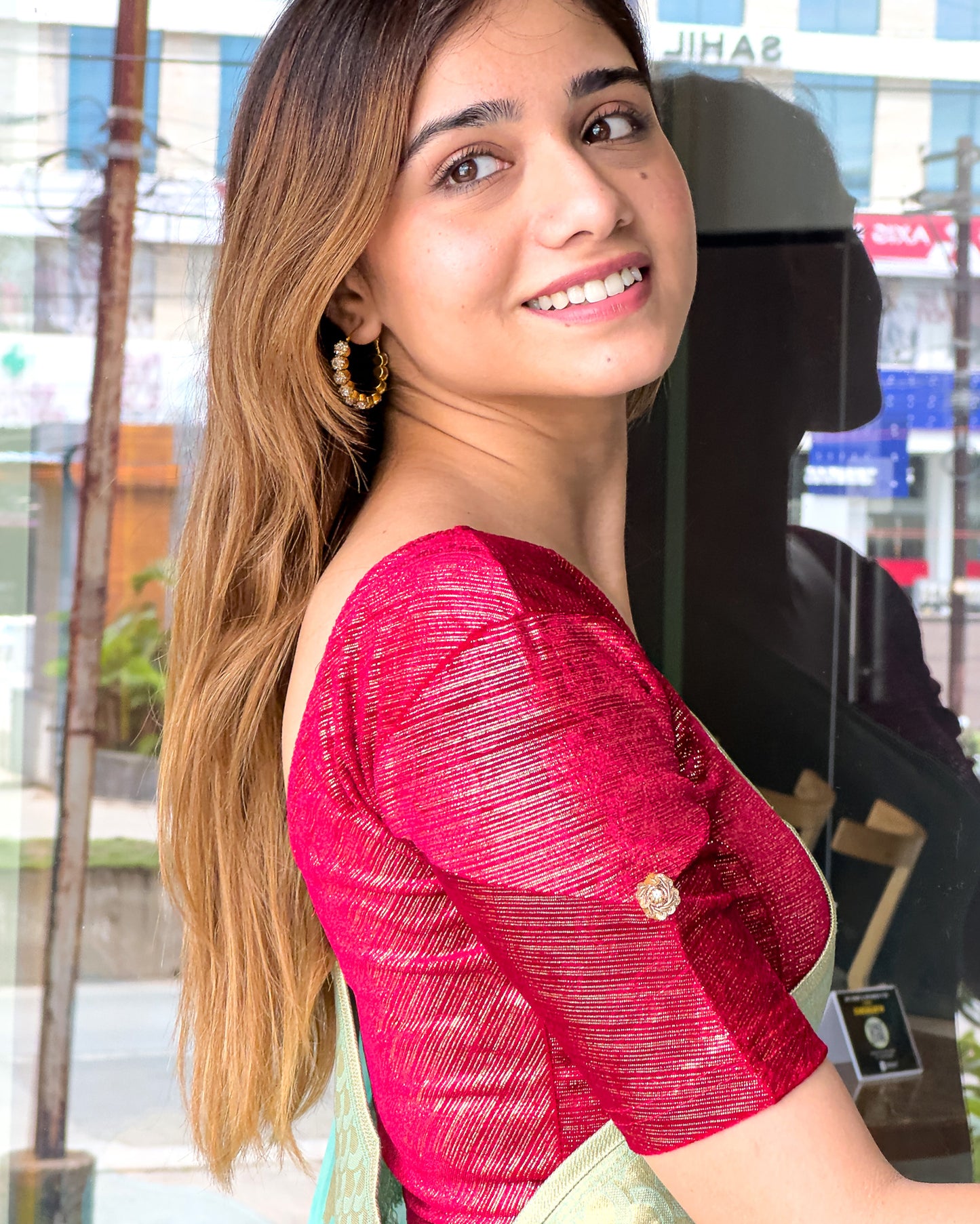Model pairing the blouse with a saree for a refined festive look