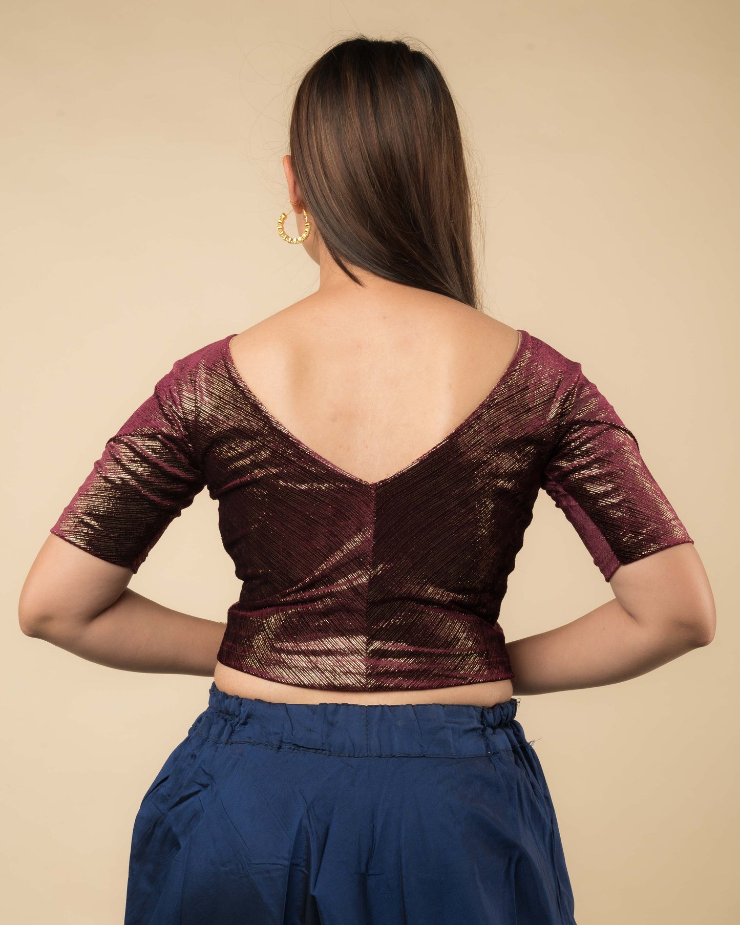 Rear view showcasing the back silhouette and velvet drape