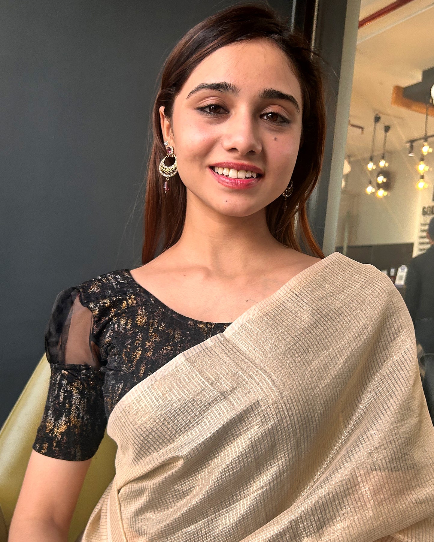 Model pairing the blouse with a saree for a stylish, festive look
