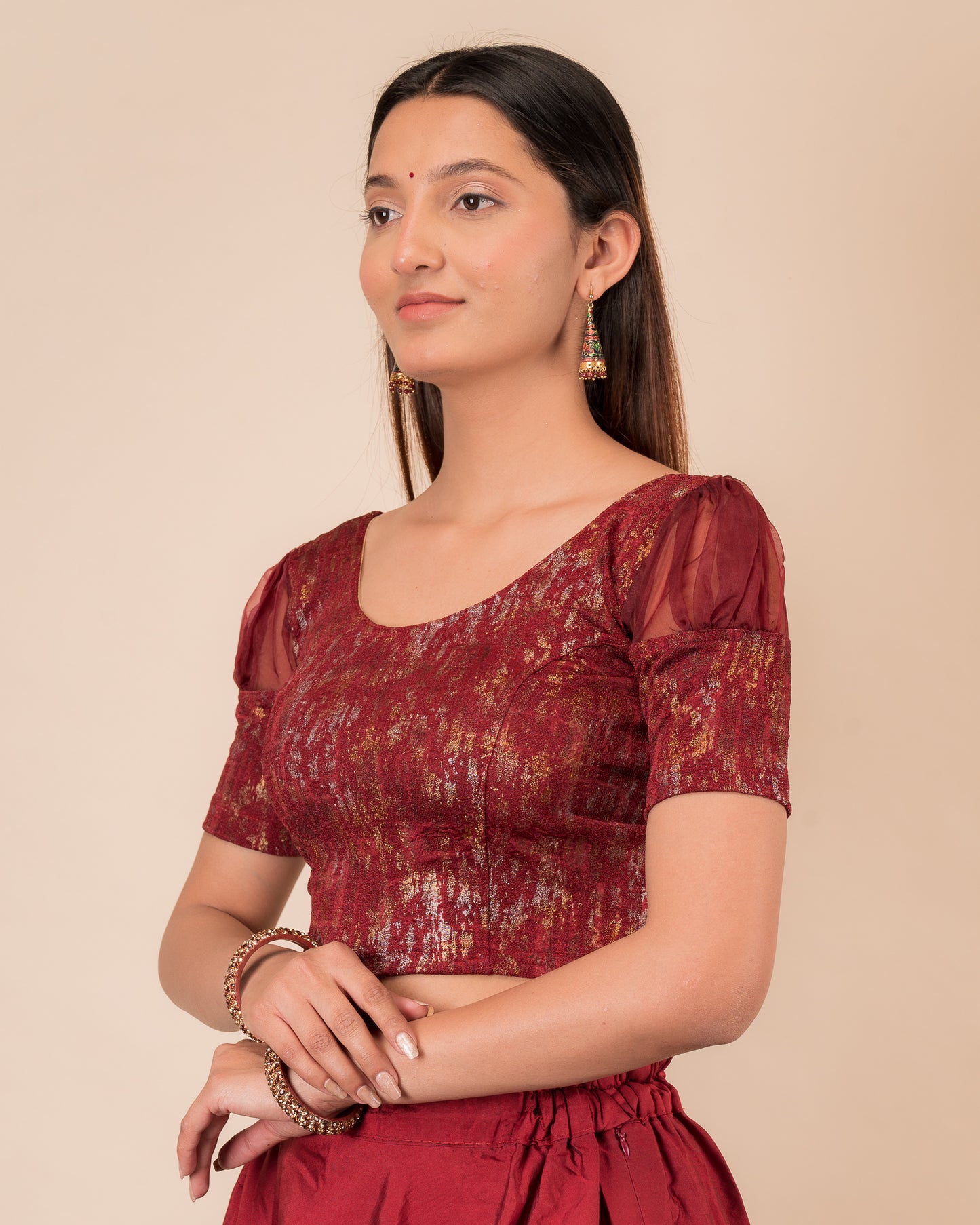 Side profile highlighting the organza puff sleeves and fit