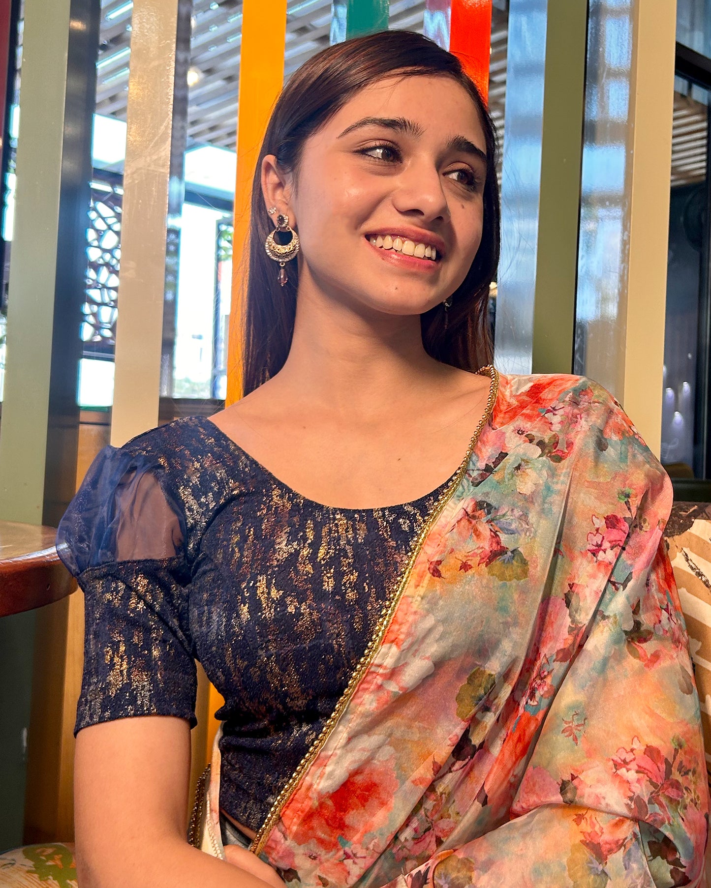Model pairing the blouse with a saree for a stylish, festive look