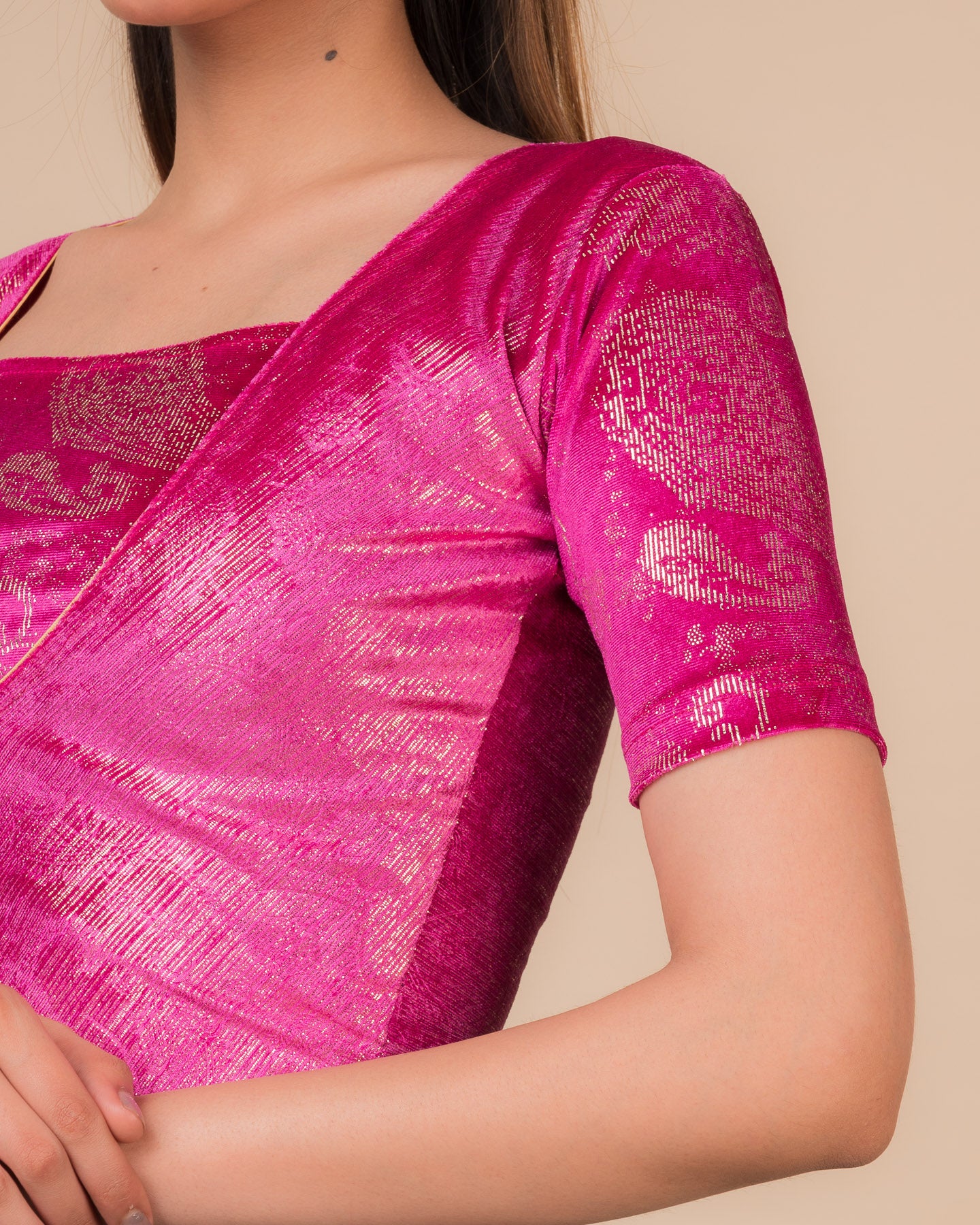 Close-up of the wine-colored velvet fabric detailing the texture and embellishments of the readymade blouse.