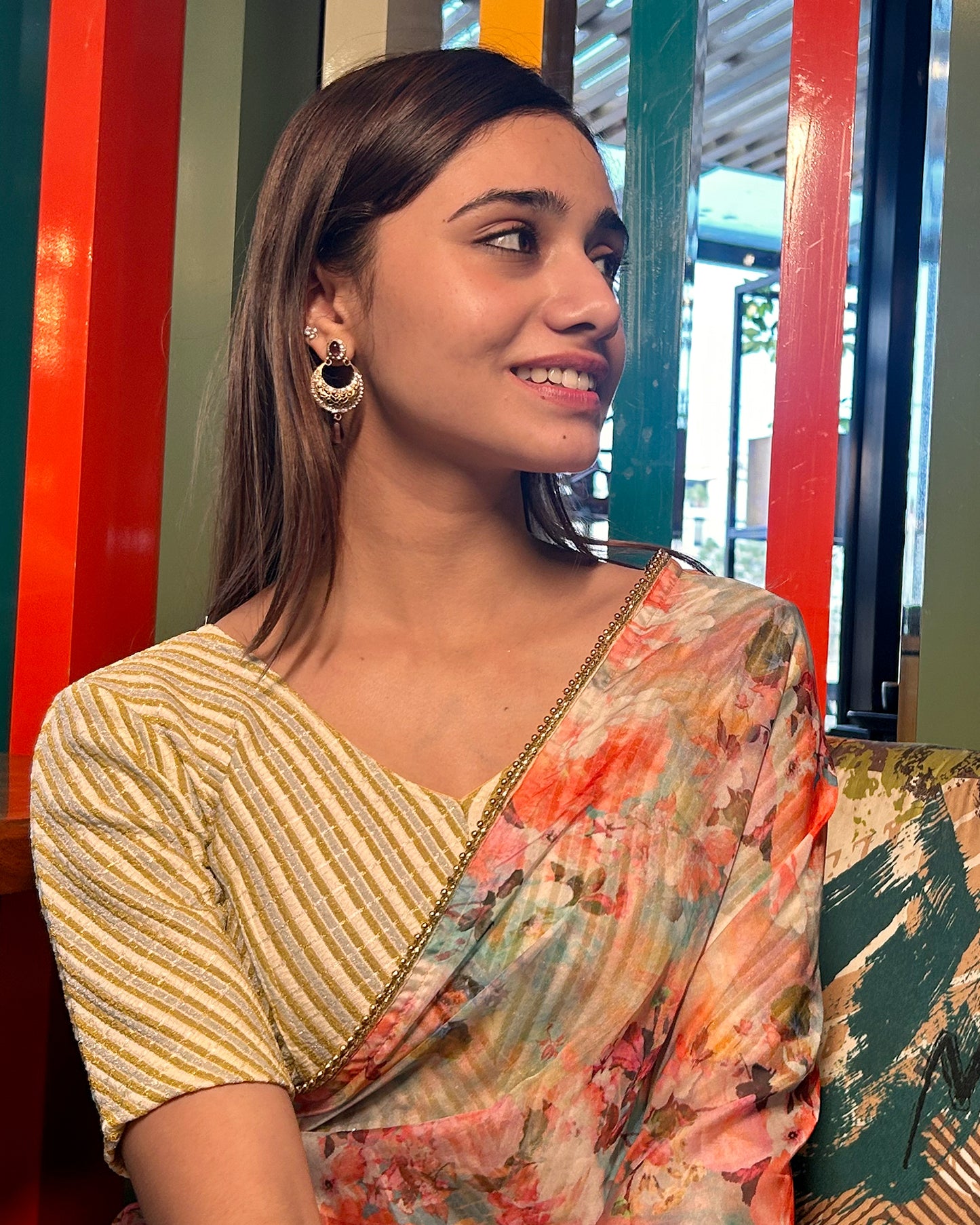 Model pairing the cream gold zari stretchable blouse with a traditional saree, demonstrating a complete ethnic look.