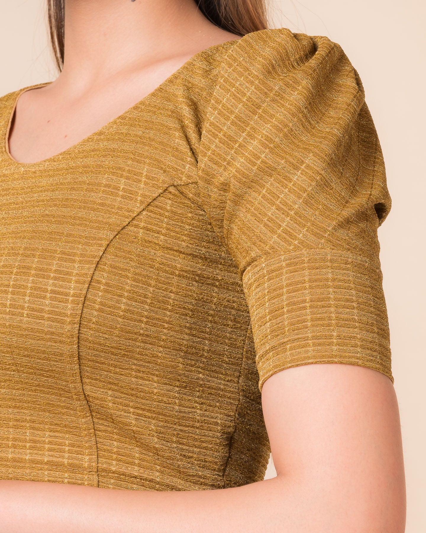 Close-up of the zari single-stripe fabric detailing the texture and stretchability of the readymade blouse.