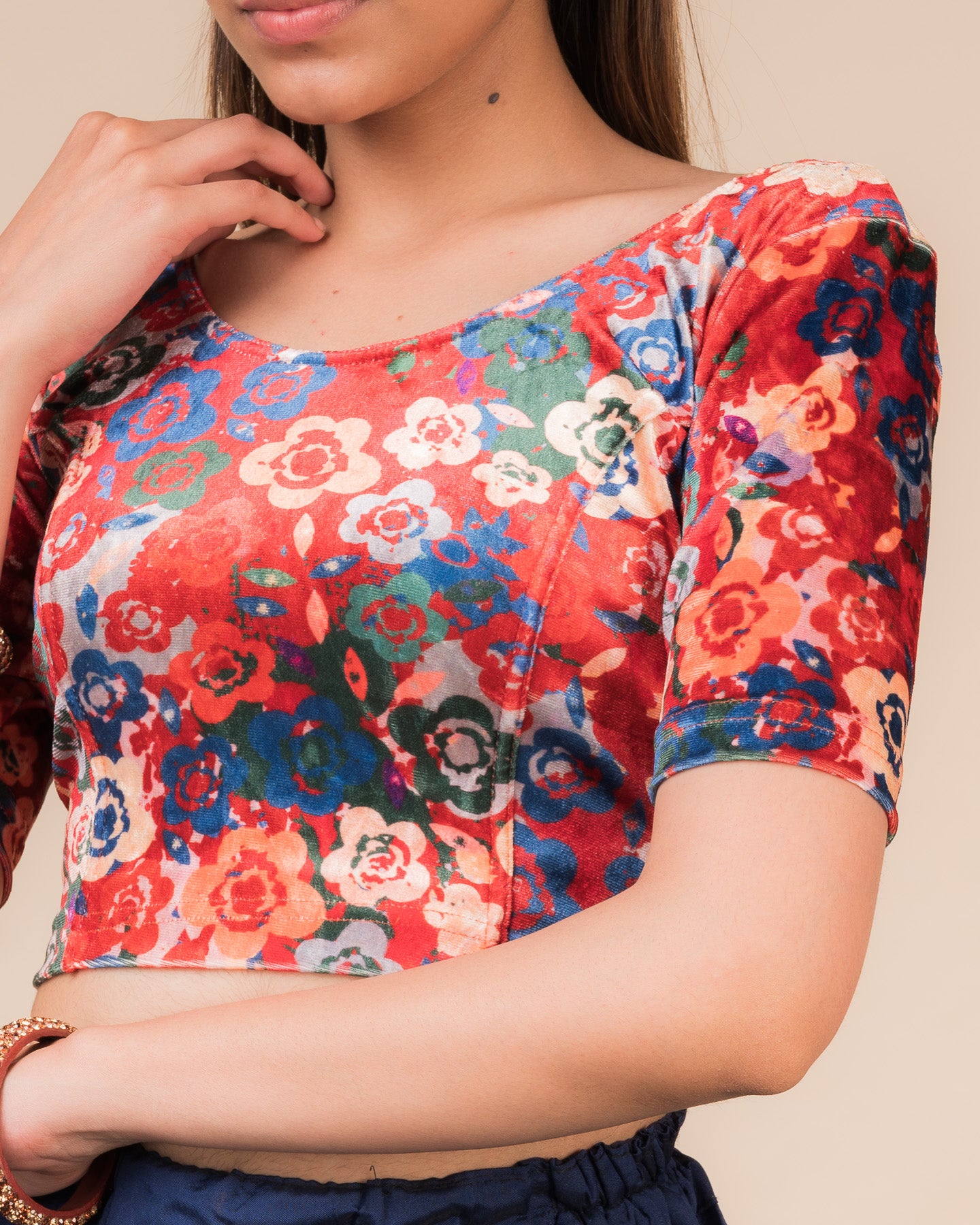 Close-up of the floral velvet fabric detailing the texture and stretchability of the readymade blouse.