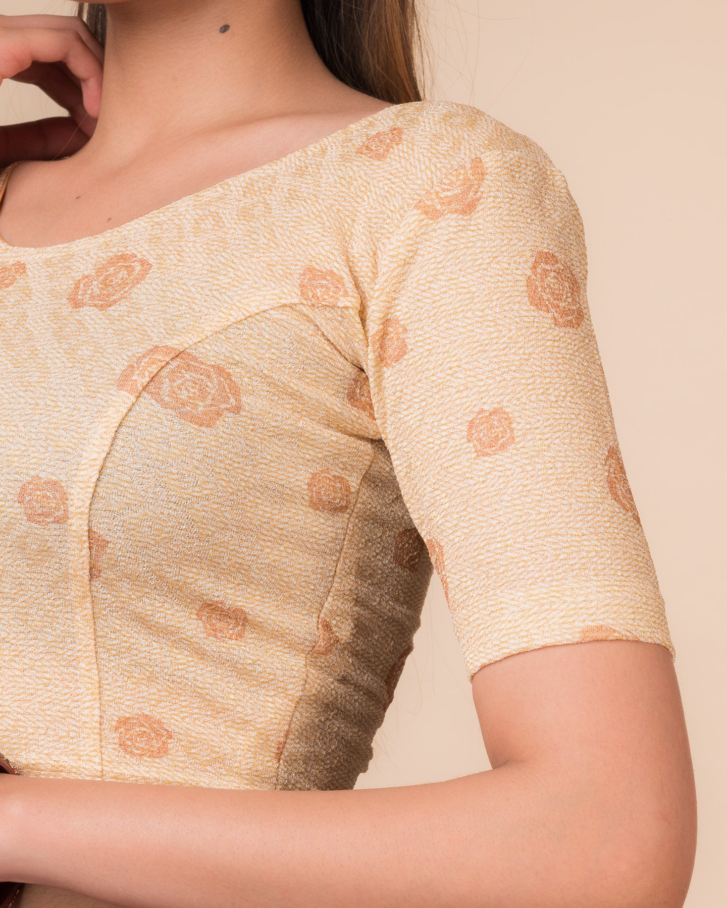 Close-up of the metallic zigzag fabric detailing the texture and stretchability of the readymade blouse.