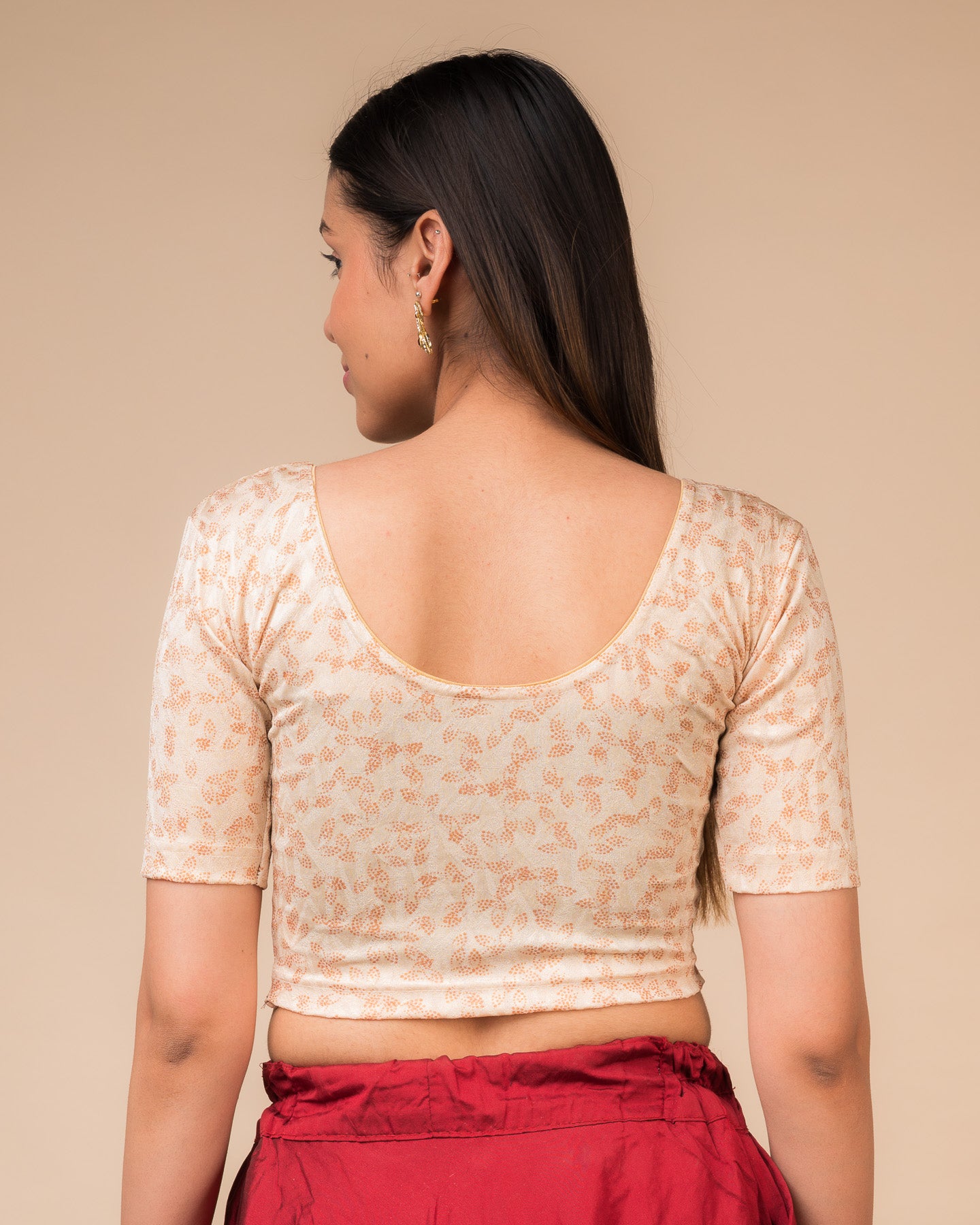 Rear view of the textured stretchable blouse showcasing the back design.