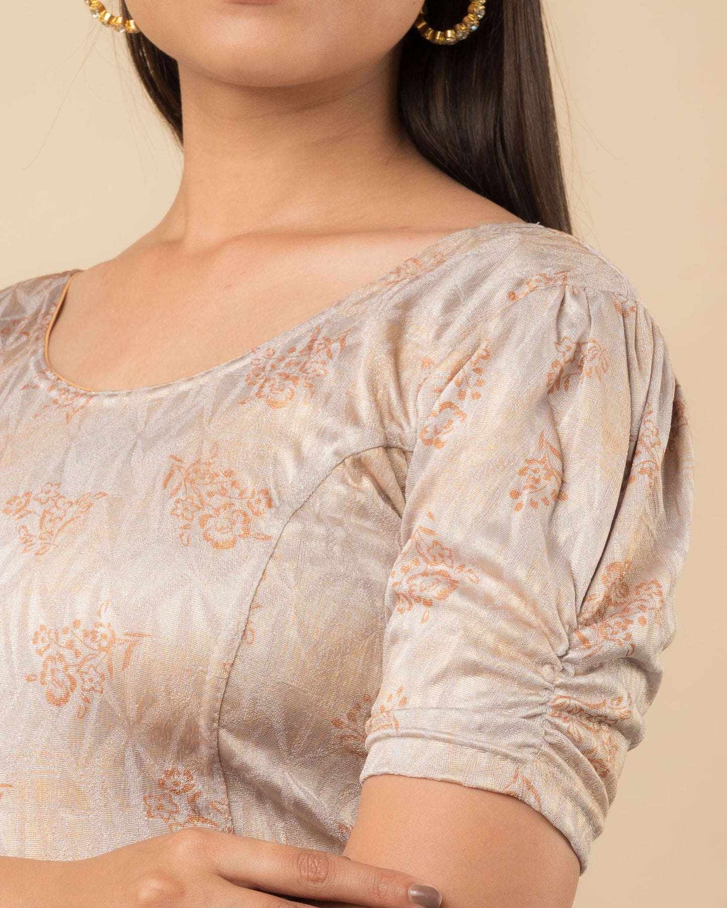 Close-up of the jacquard fabric detailing the texture and embellishments of the readymade blouse.